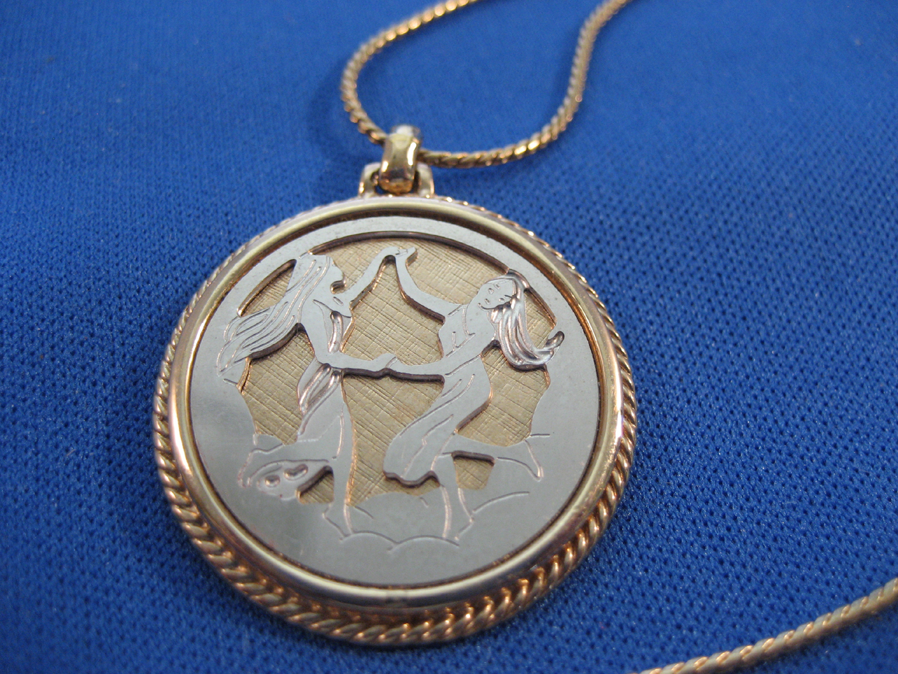 Avon Gold and Silver Genini Necklace