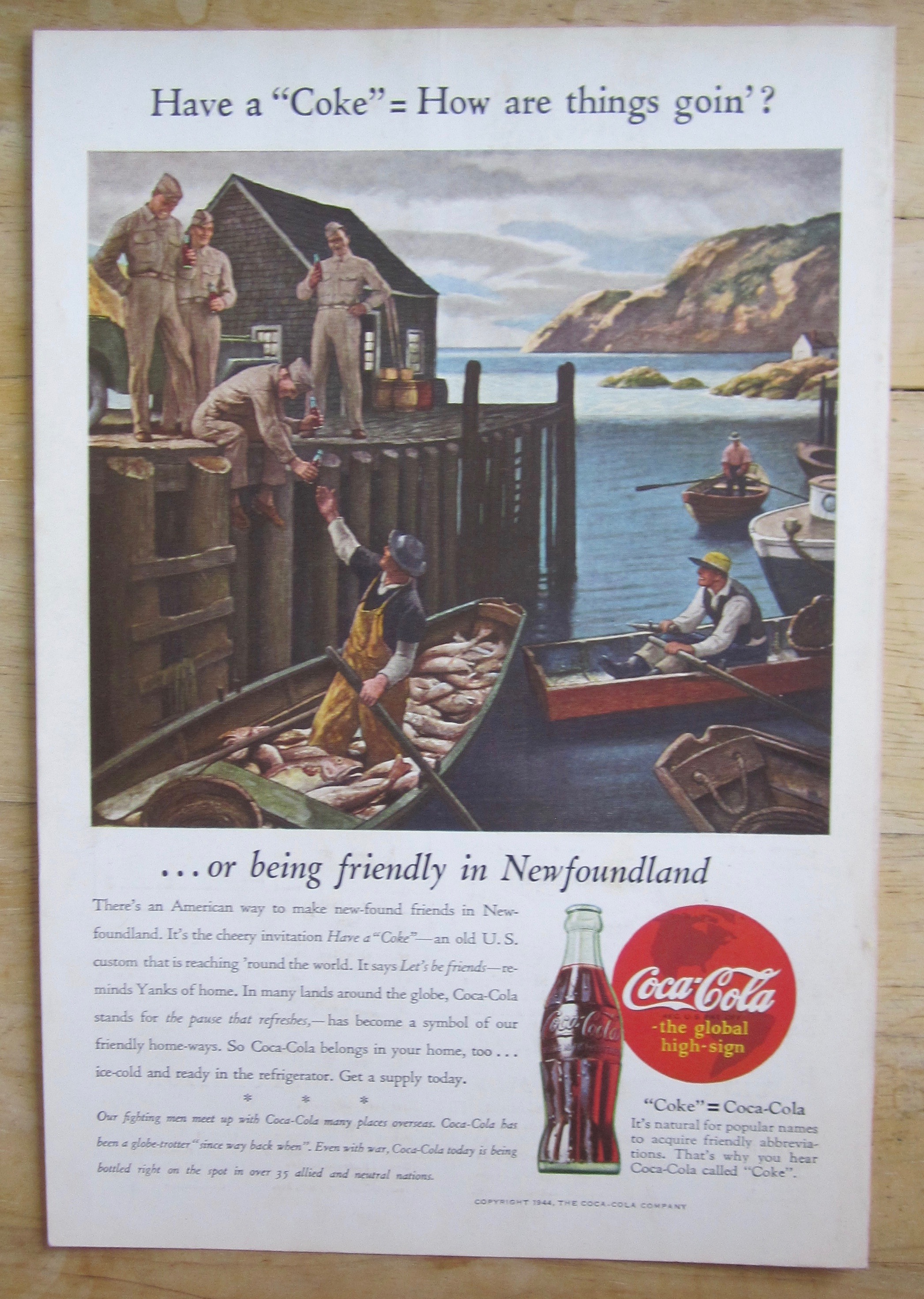 1944 Coca Cola w Soldier Giving Soda To Fisherman