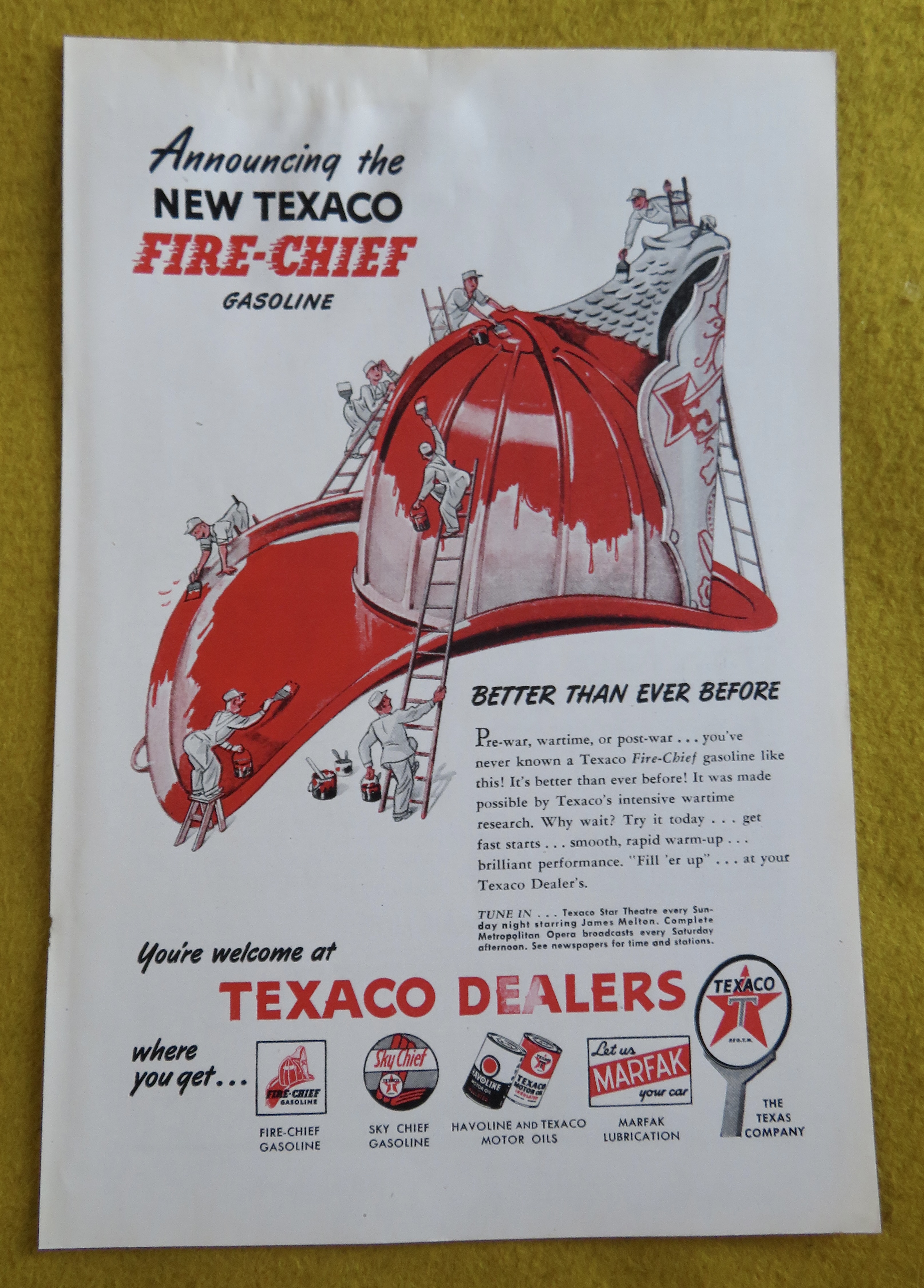 1946 Texaco Dealers with Little Men Cleaning Helmet