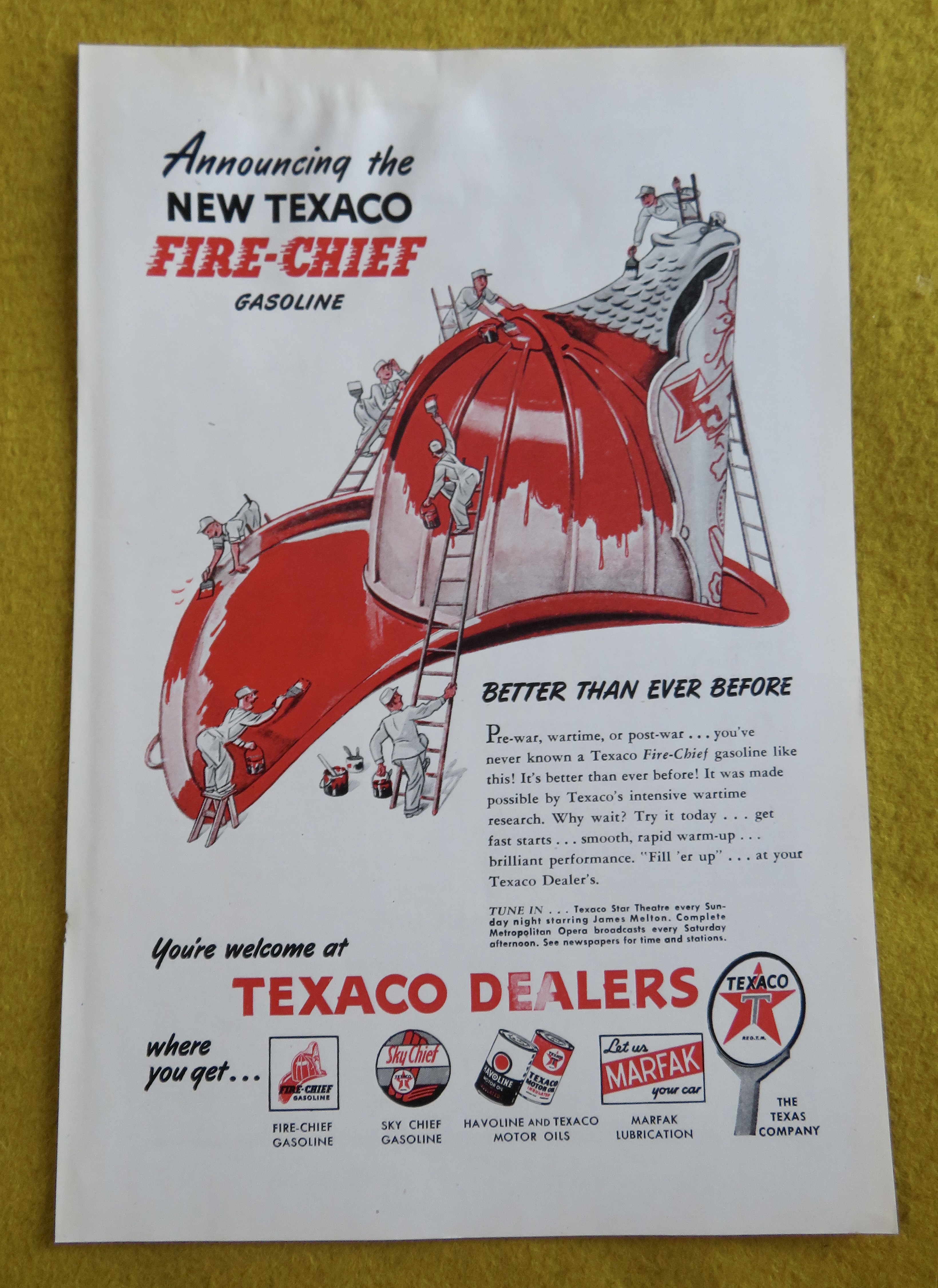 1946 Texaco Dealers with Little Men Cleaning Helmet