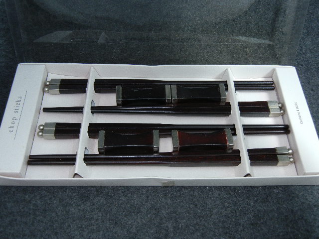 4 Pair fancy chop stick in box with rests