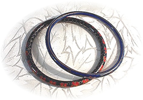 2 Cloisinee Bangle Bracelets.