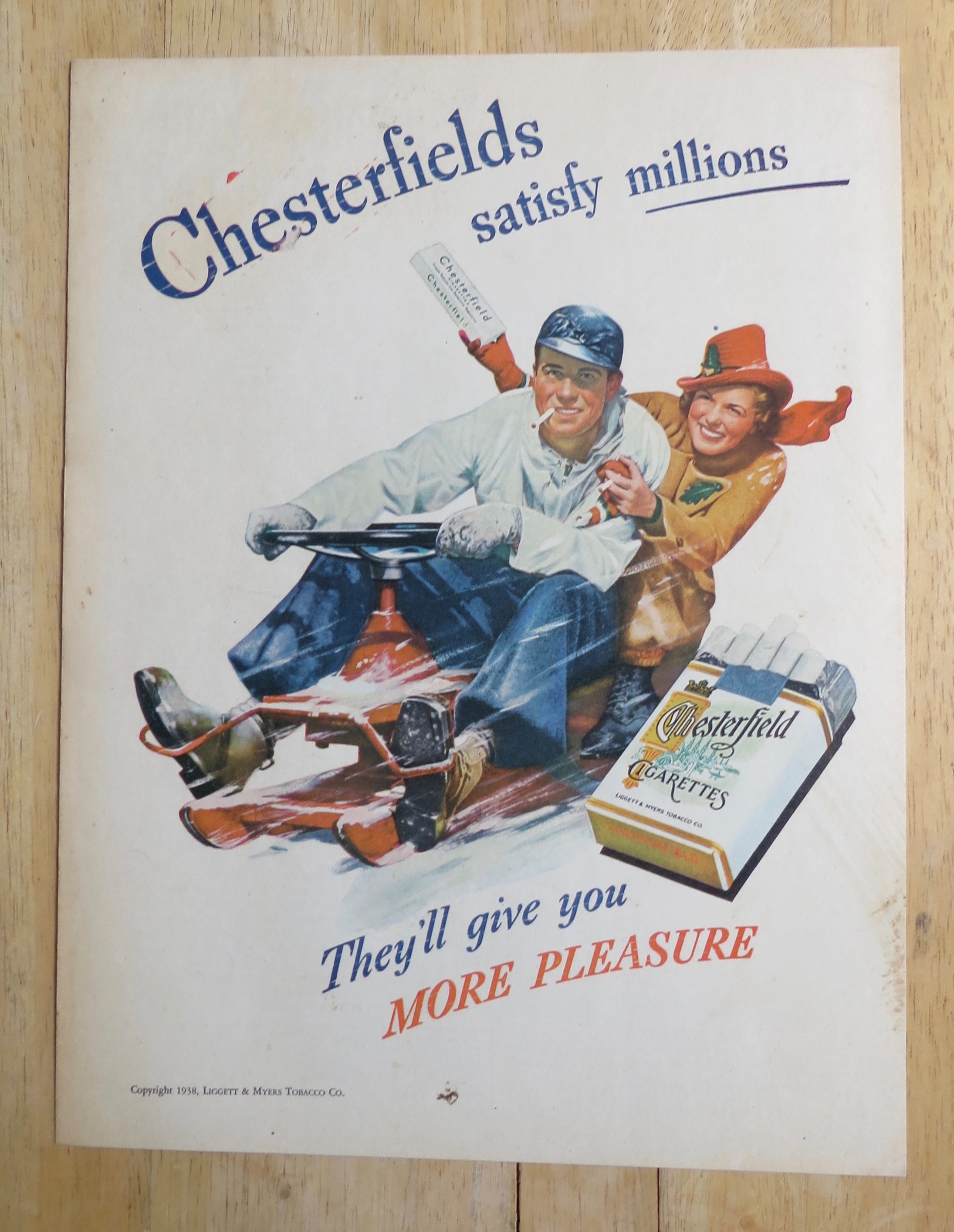 1938 Chesterfield Cigarettes with Man & Woman in Snow