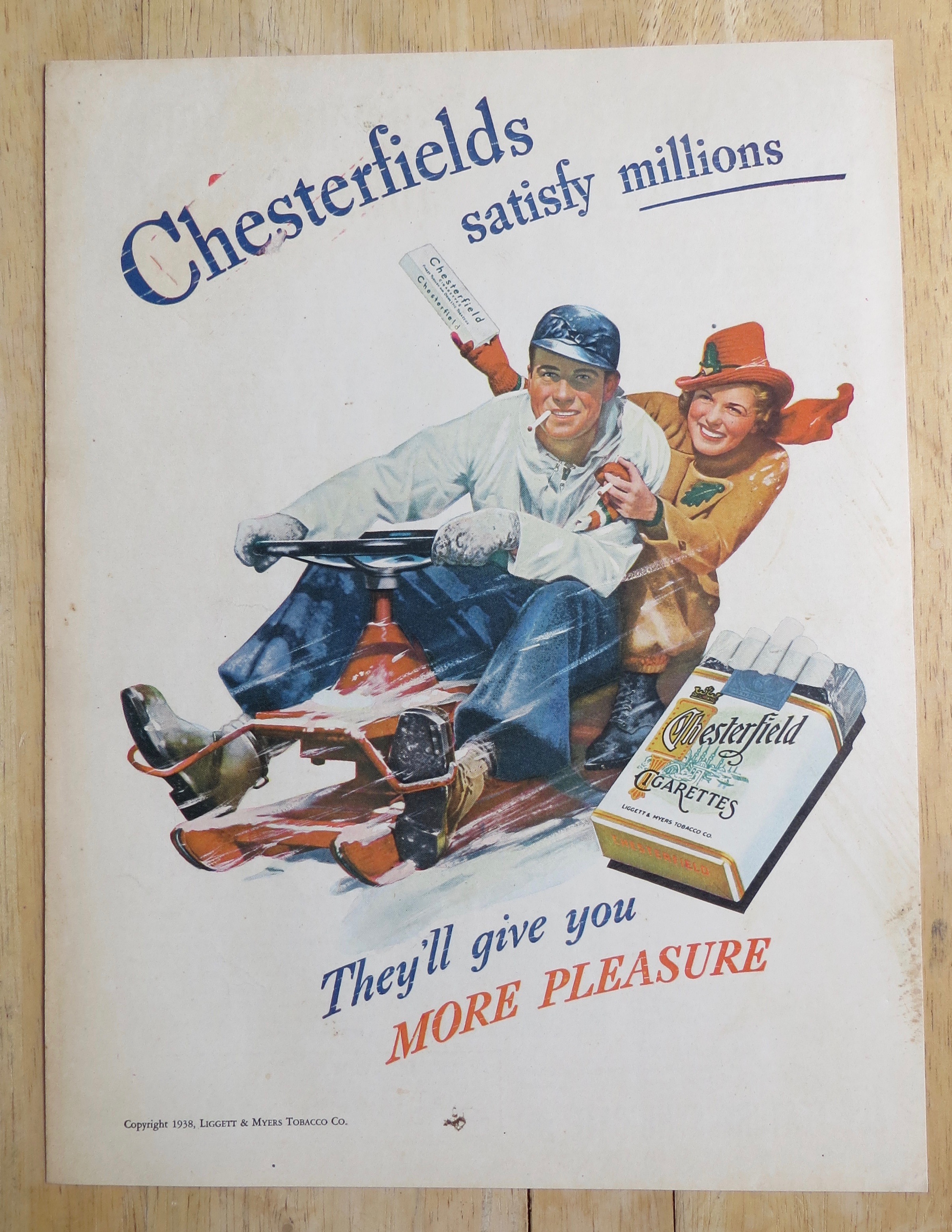 1938 Chesterfield Cigarettes with Man & Woman in Snow
