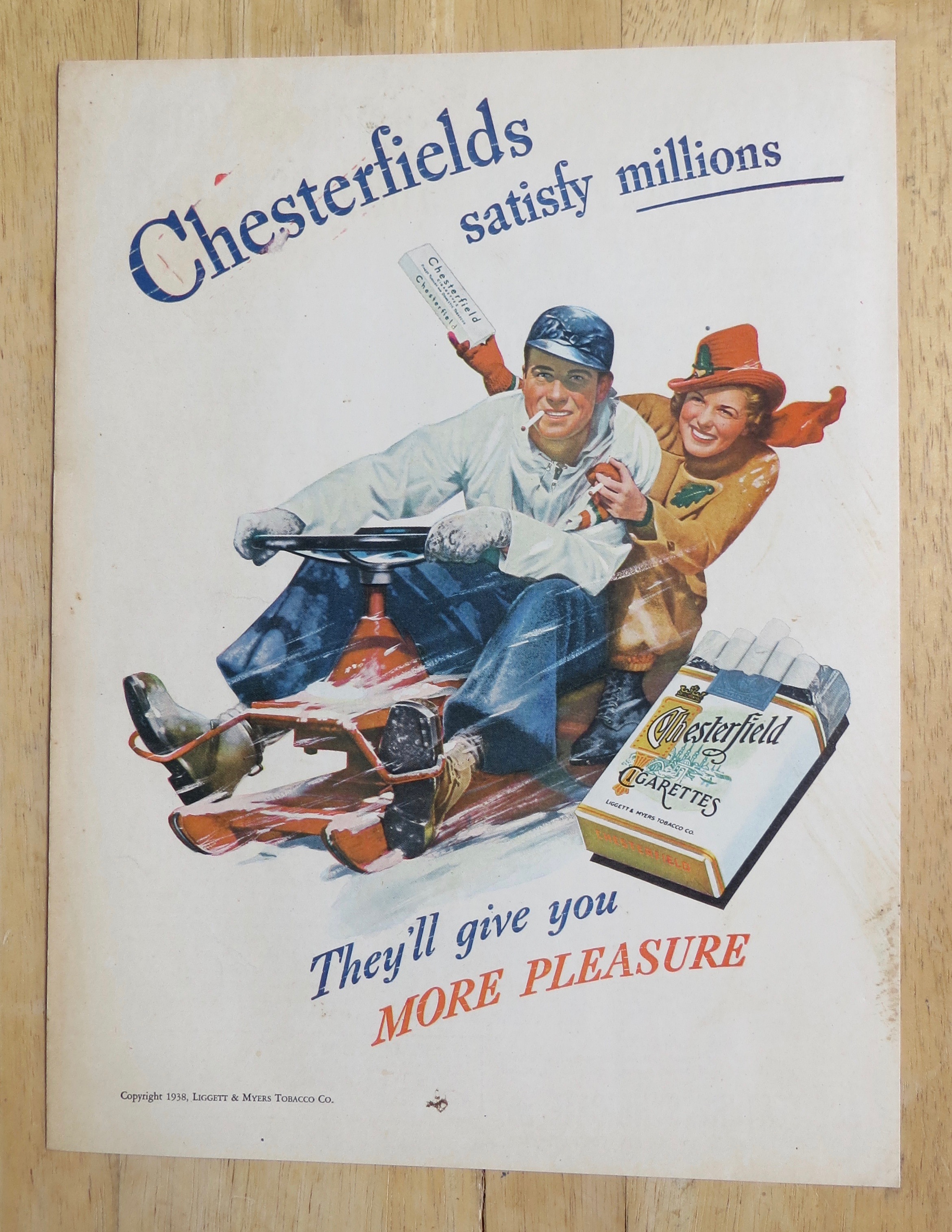 1938 Chesterfield Cigarettes with Man & Woman in Snow