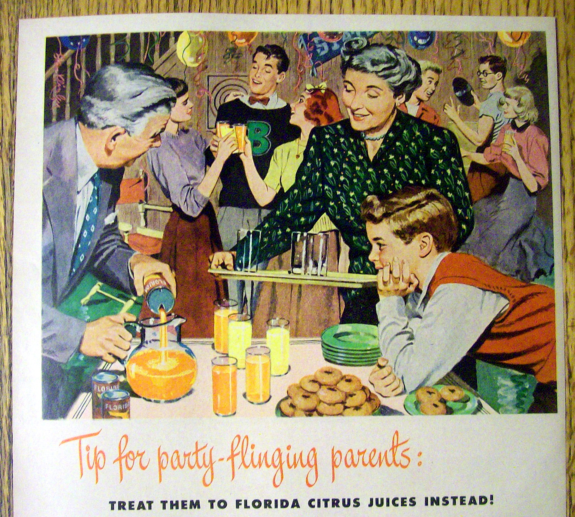 1949 Florida Canned Orange Juice with Woman Bringing a Tray of Glasses at Party