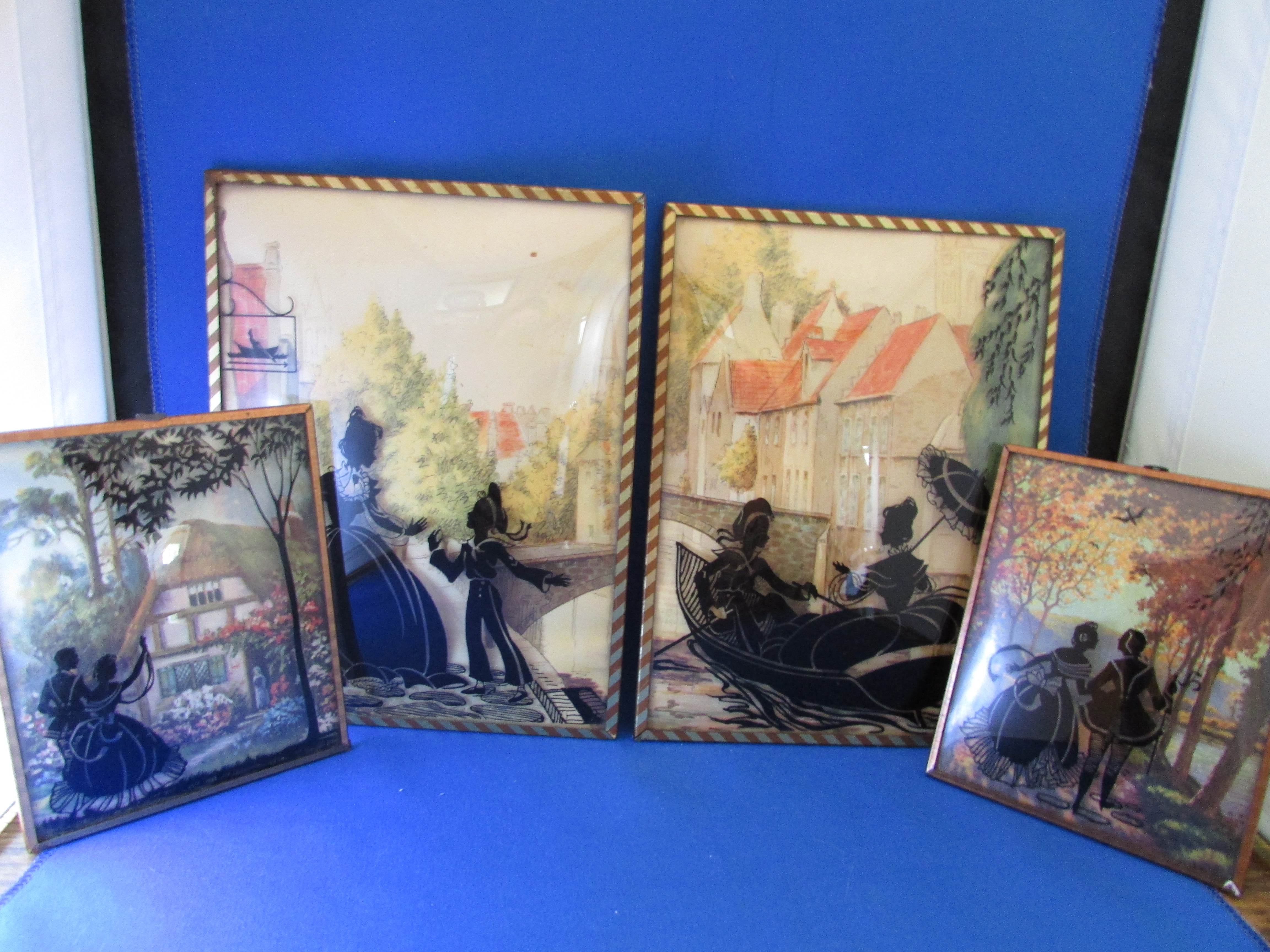 Four Edwardian Reverse Glass Wall Hangings