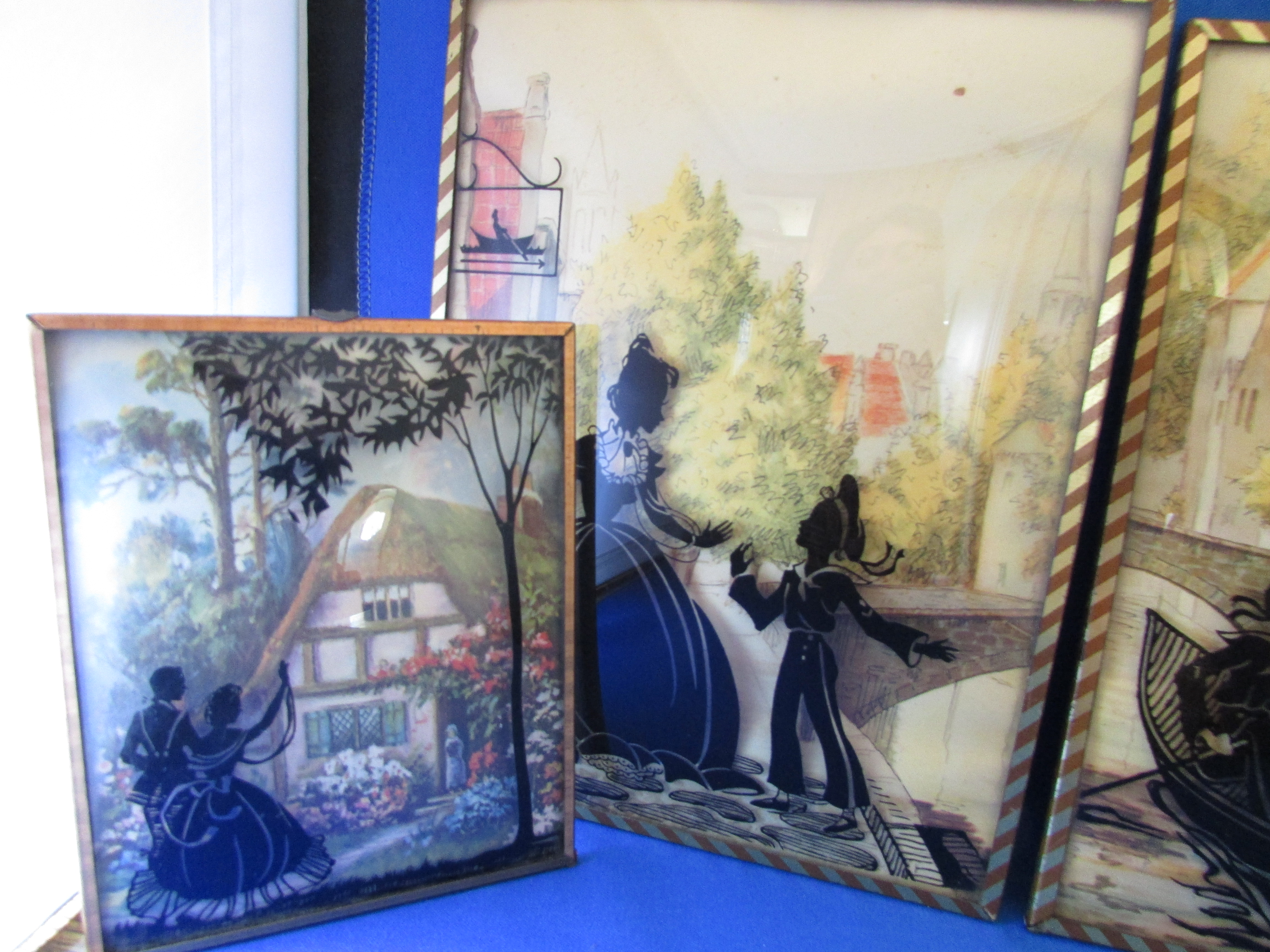 Four Edwardian Reverse Glass Wall Hangings