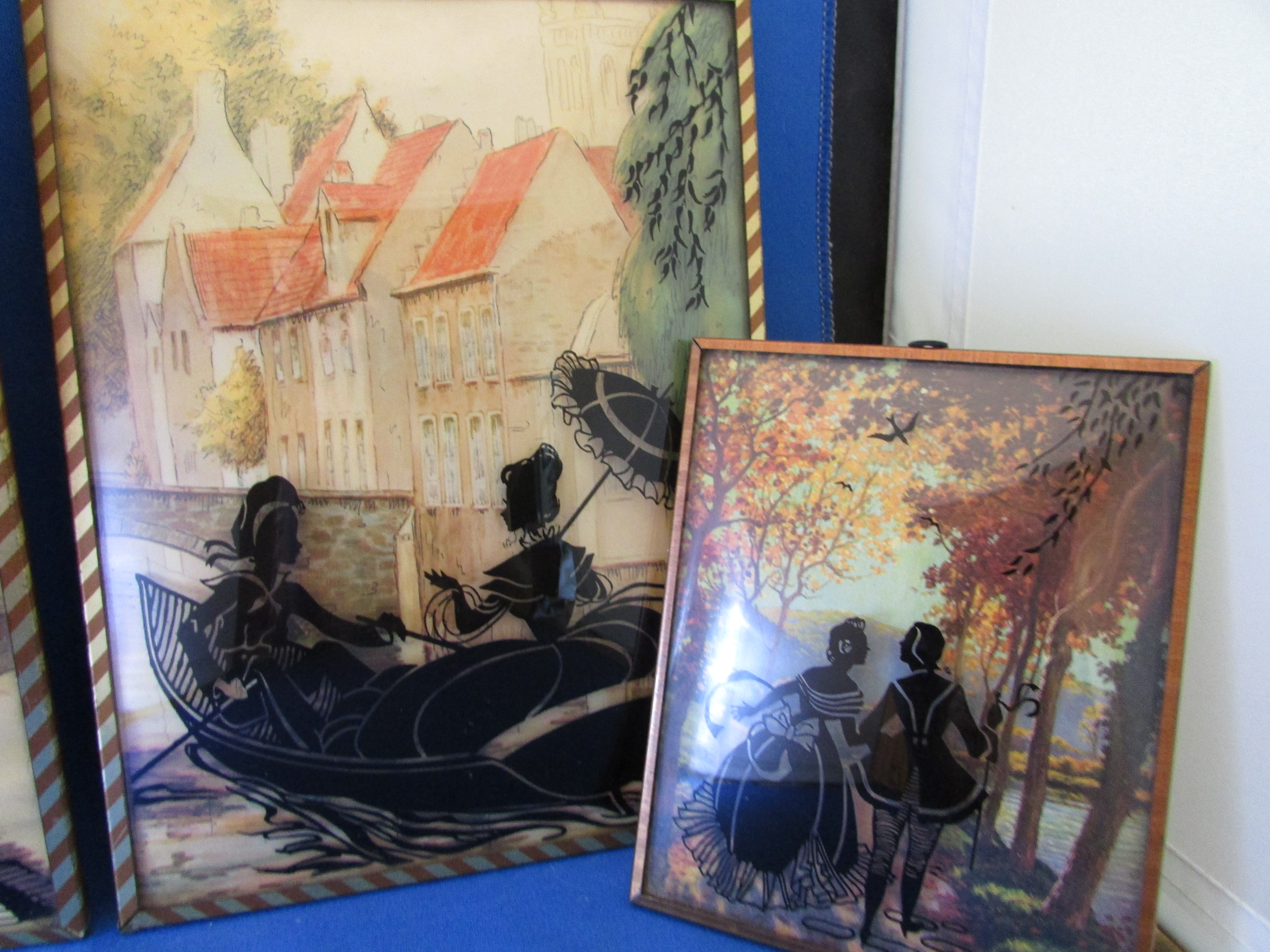 Four Edwardian Reverse Glass Wall Hangings