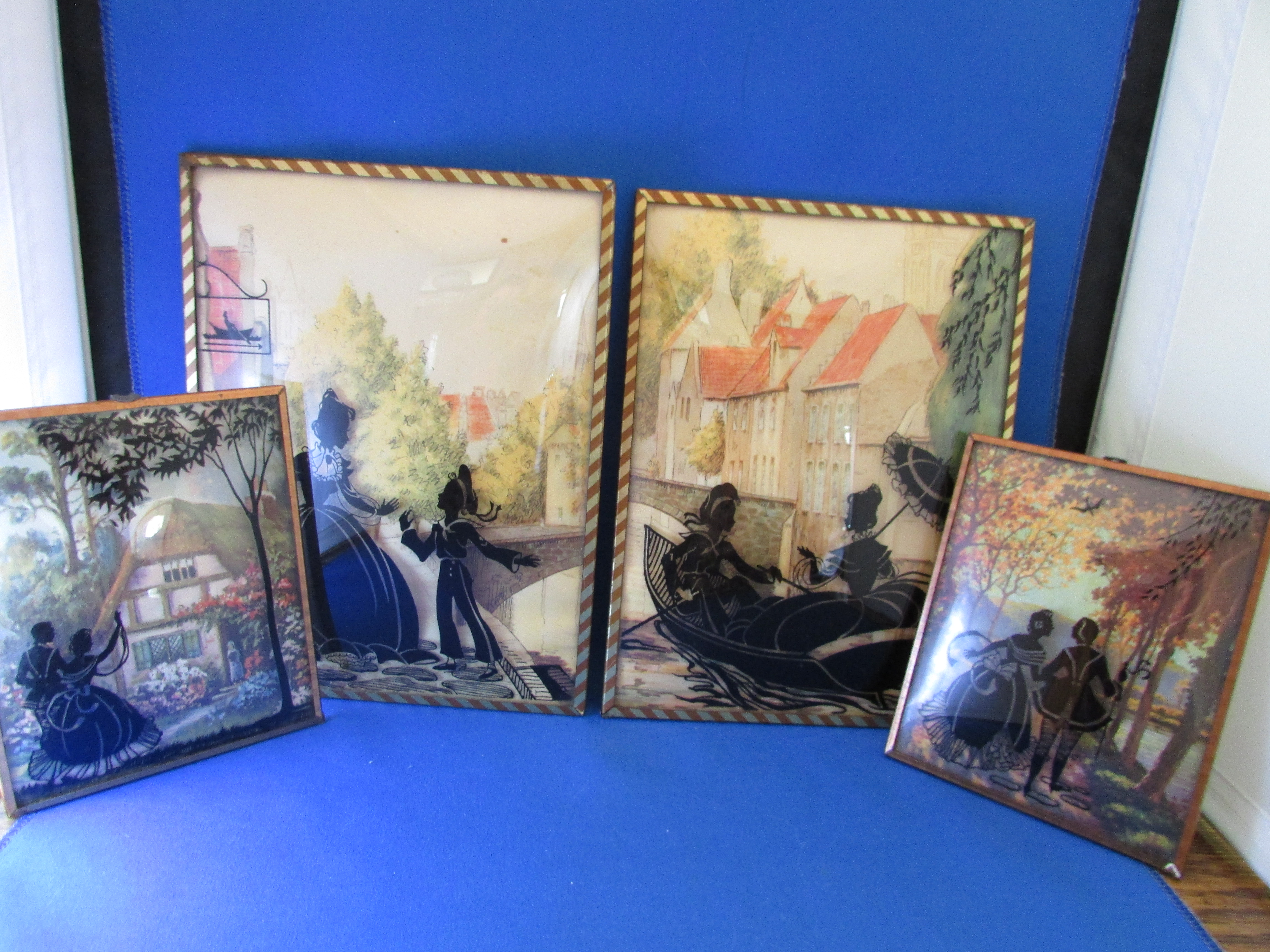 Four Edwardian Reverse Glass Wall Hangings