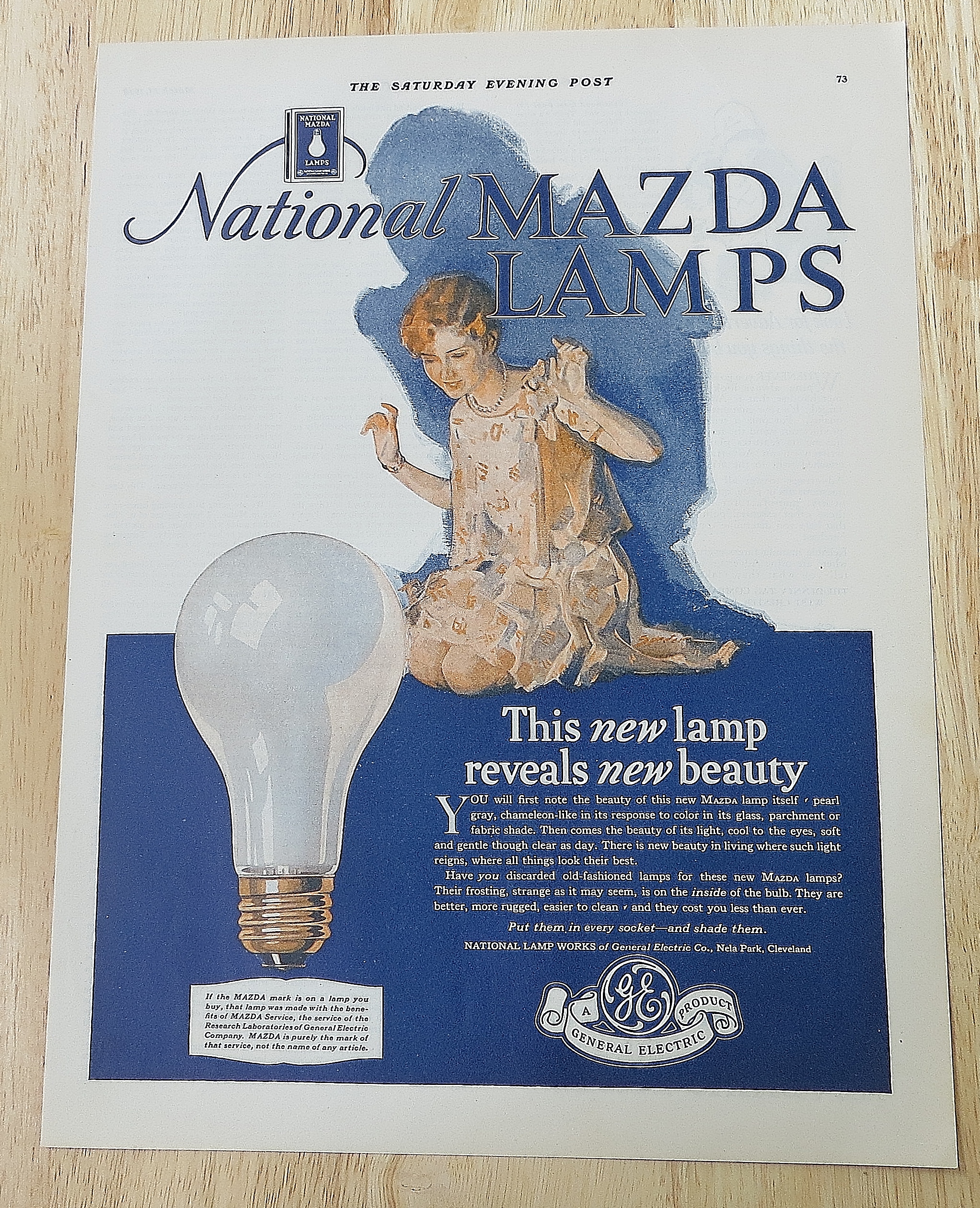 1928 Mazda Lamps With Woman Kneeling