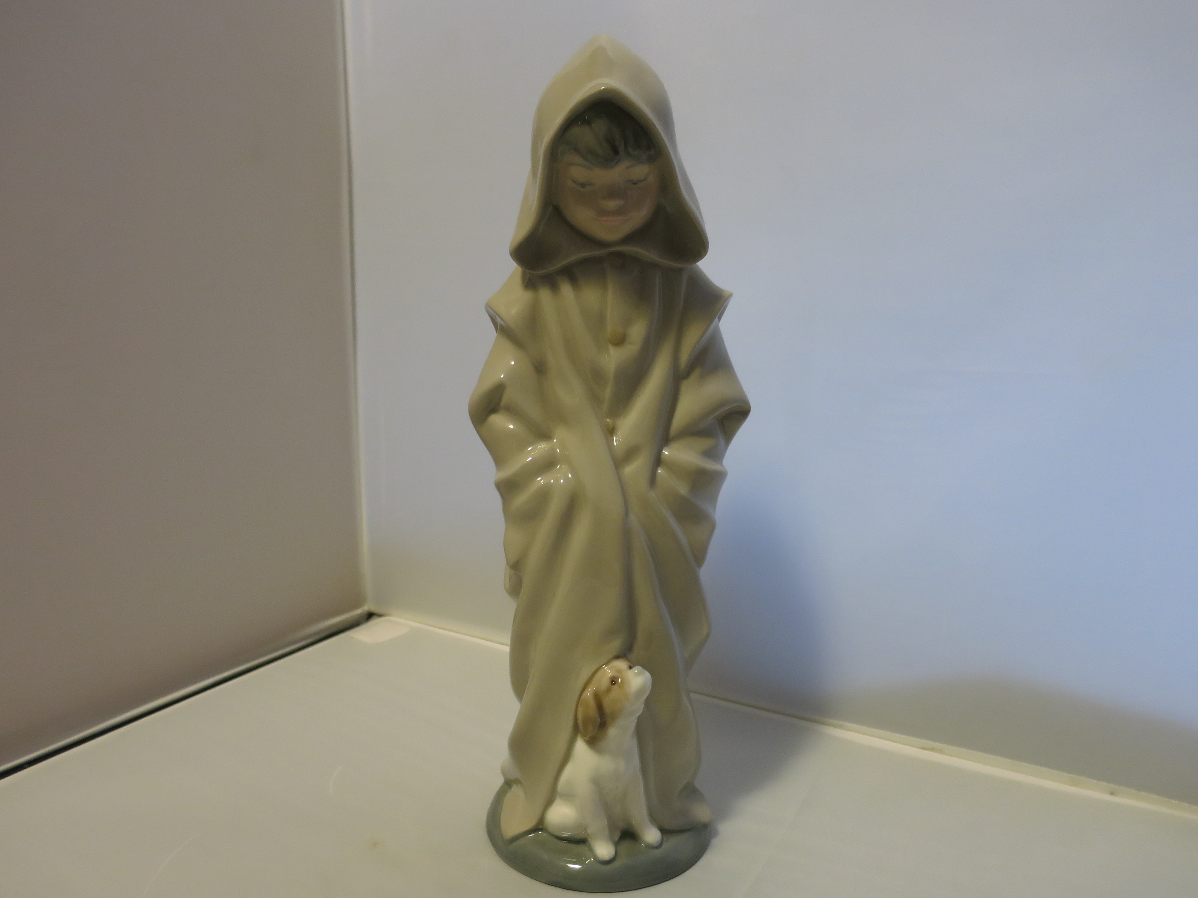 Nao Lladro Boy in Hood Coat Figurine Look Down at Dog