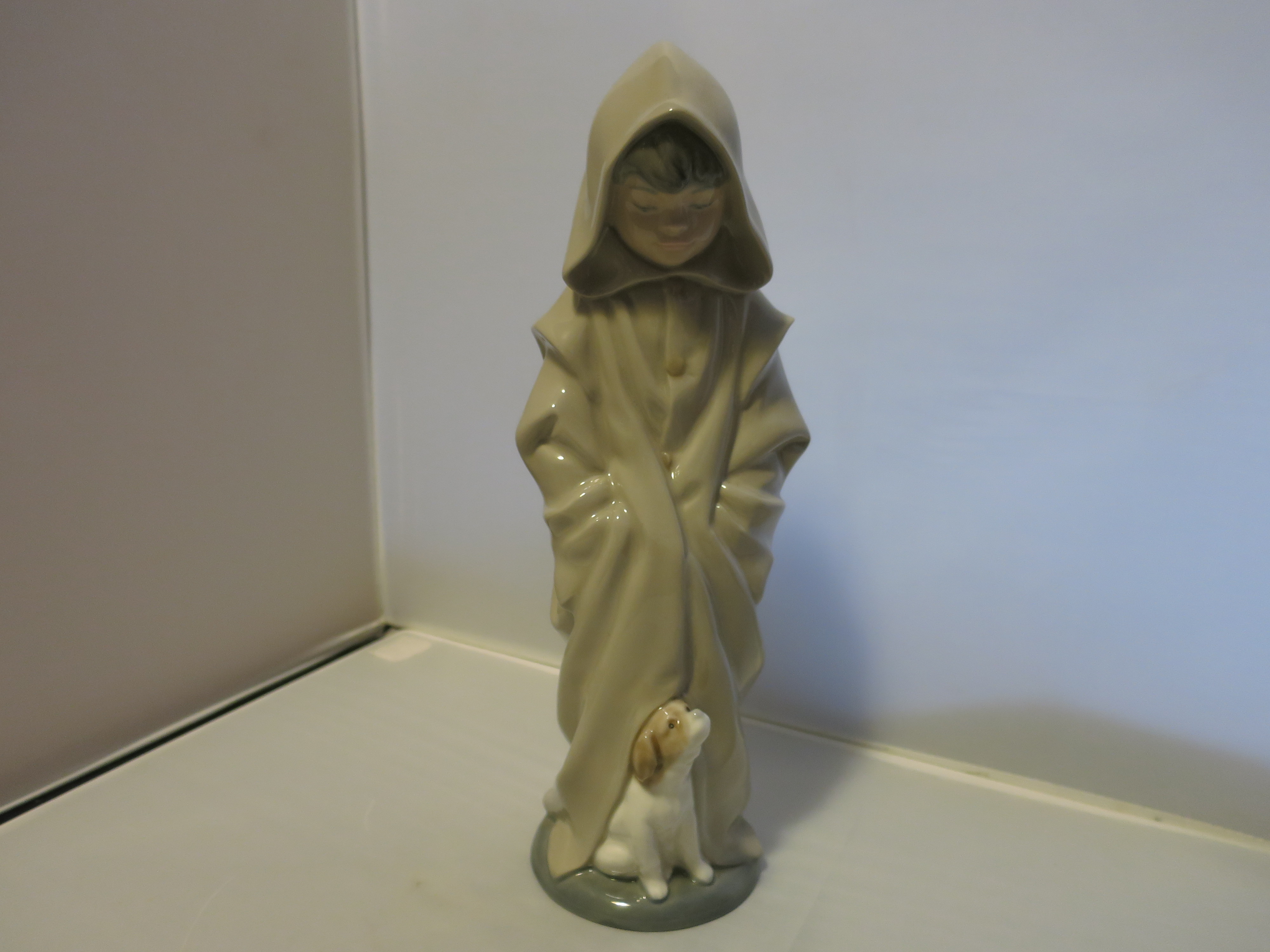 Nao Lladro Boy in Hood Coat Figurine Look Down at Dog