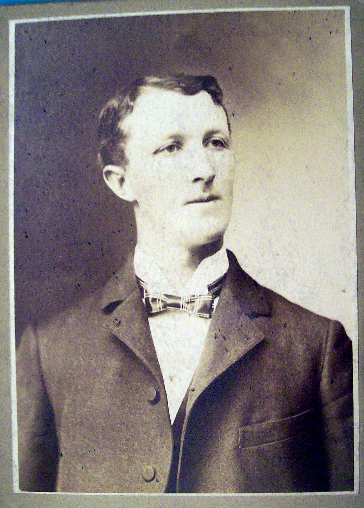 Wins By A Neck - Cabinet Photo of a Tall Man