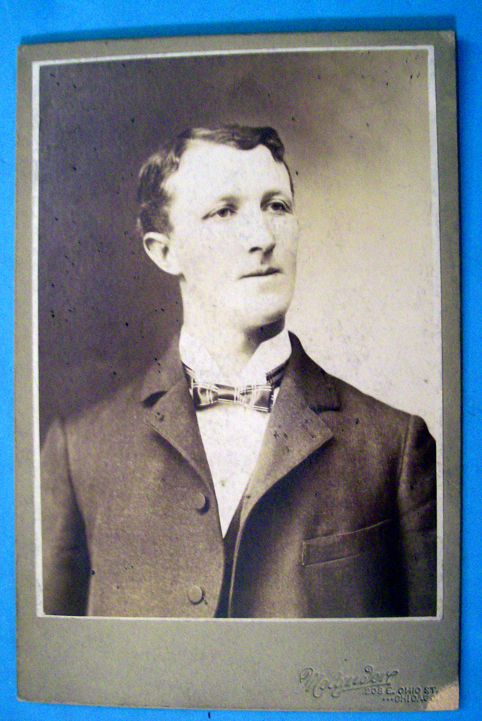 Wins By A Neck - Cabinet Photo of a Tall Man