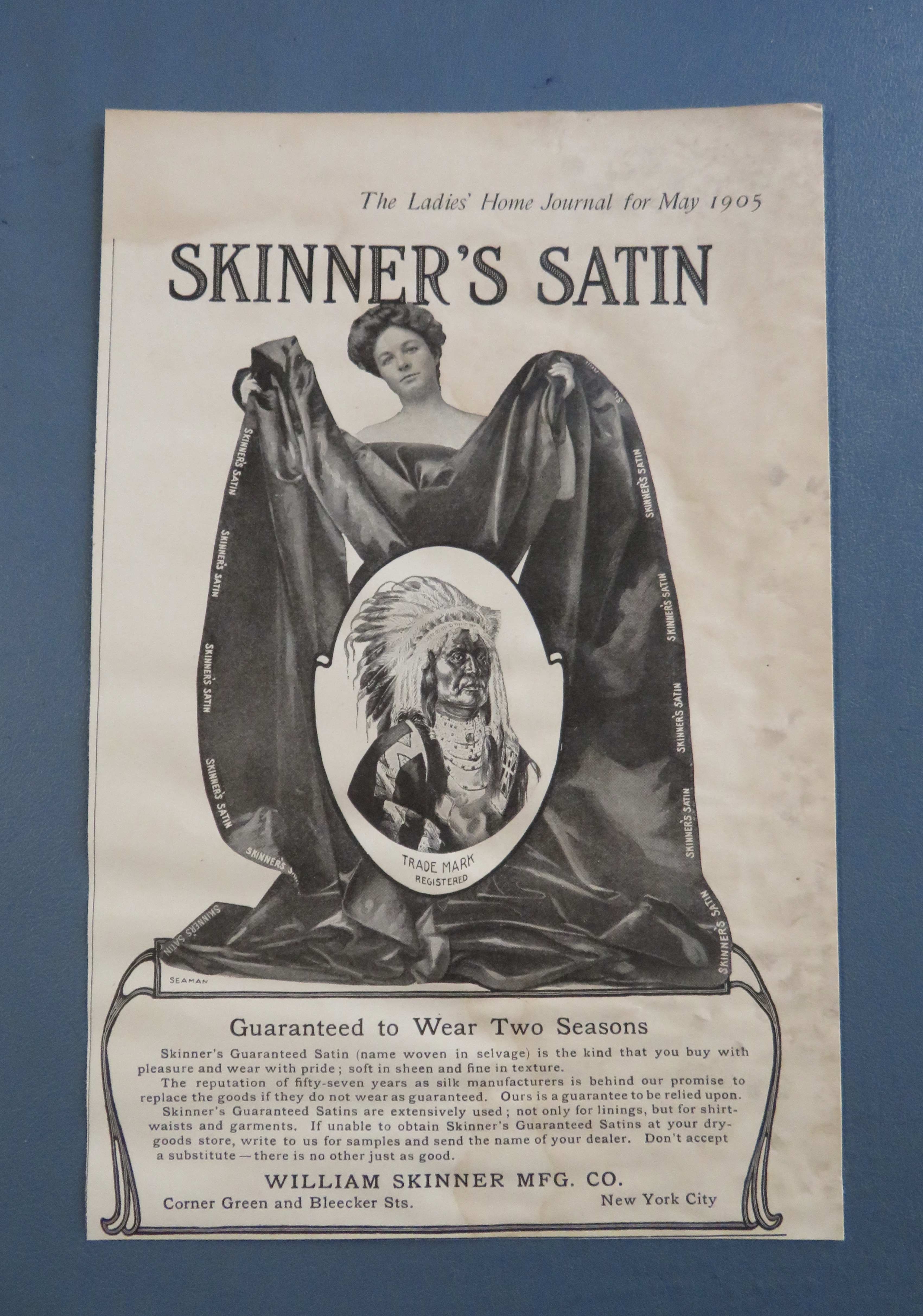 1905 Skinner's Satin with Woman Holding Blanket