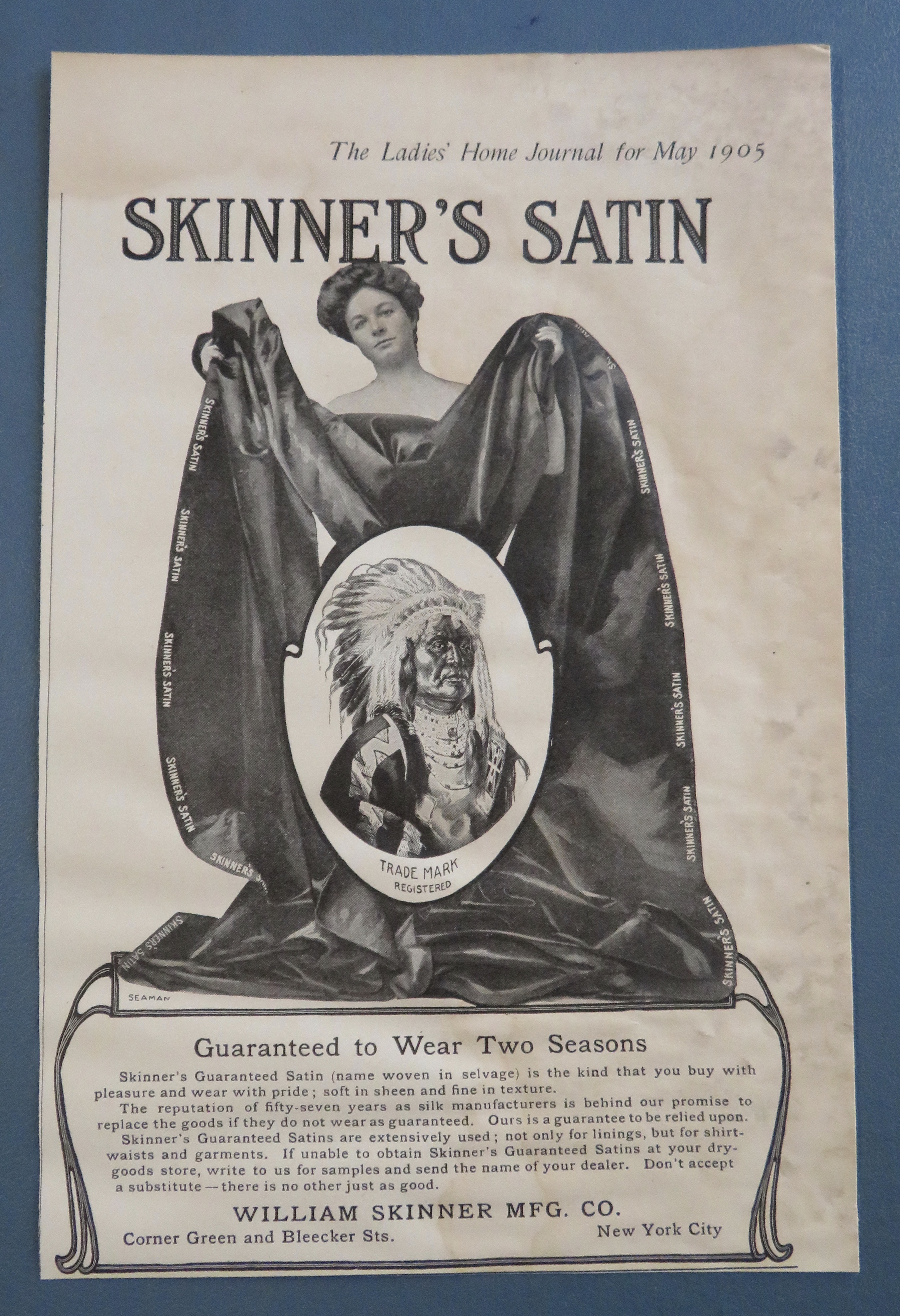 1905 Skinner's Satin with Woman Holding Blanket