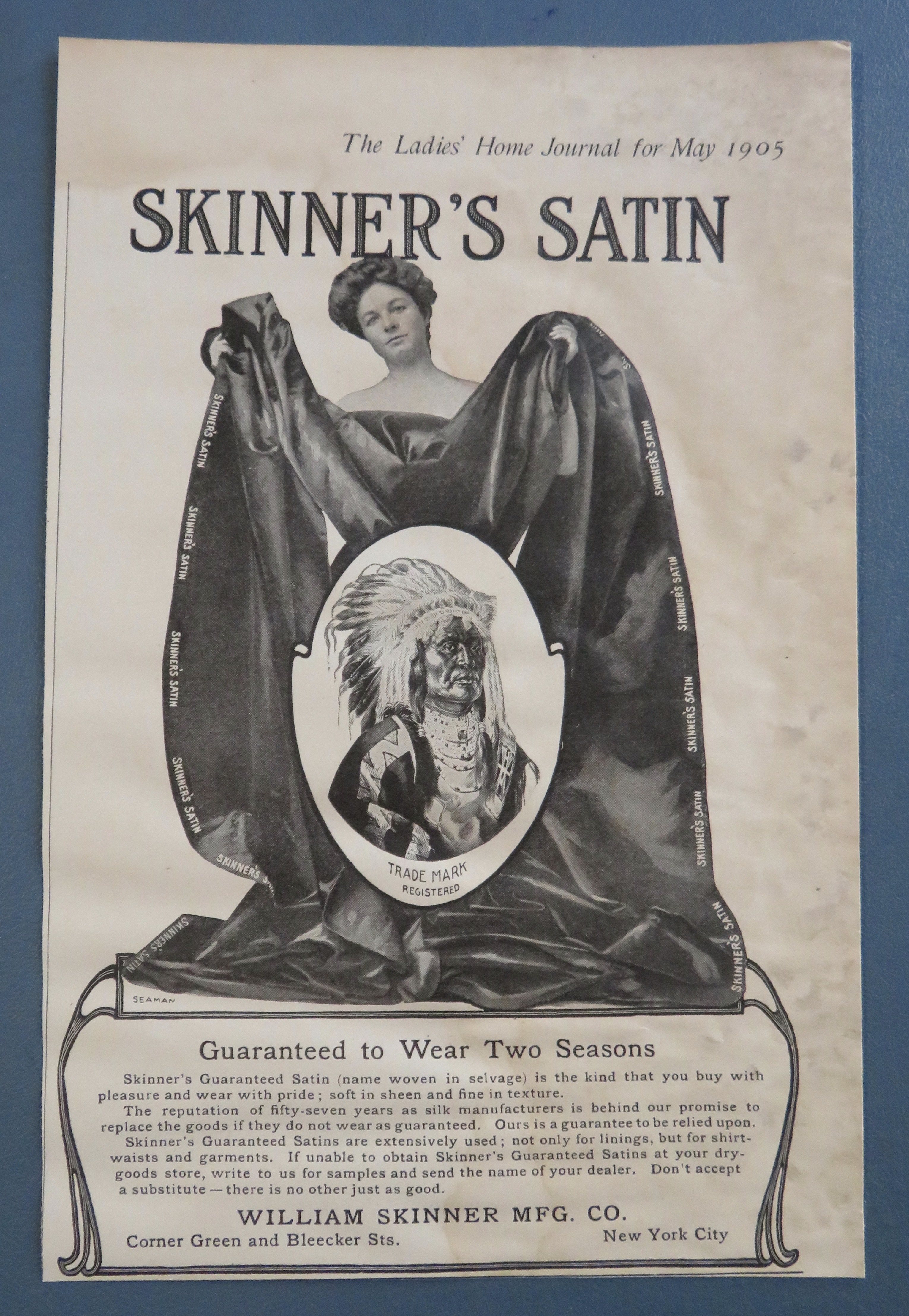 1905 Skinner's Satin with Woman Holding Blanket