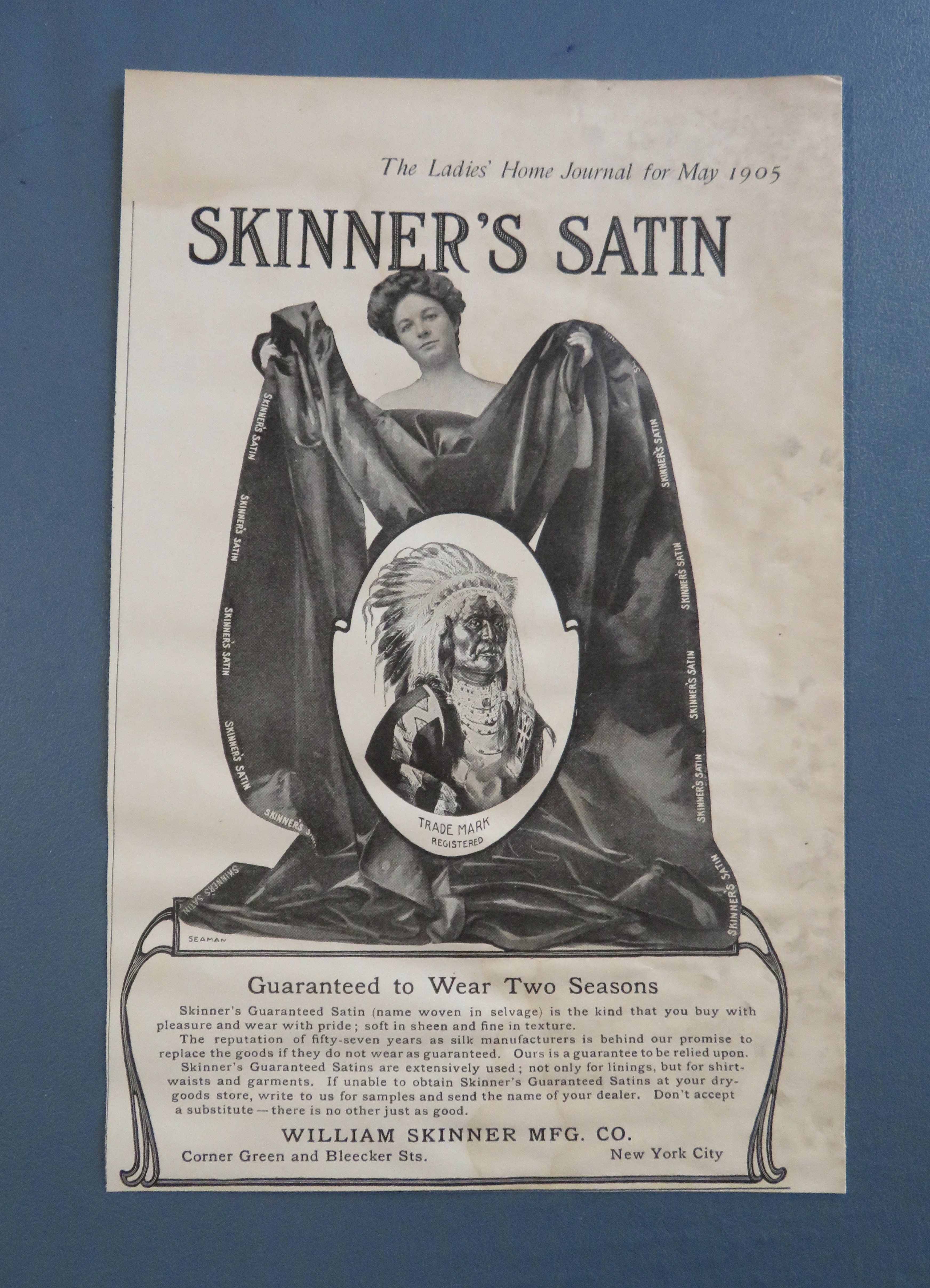 1905 Skinner's Satin with Woman Holding Blanket