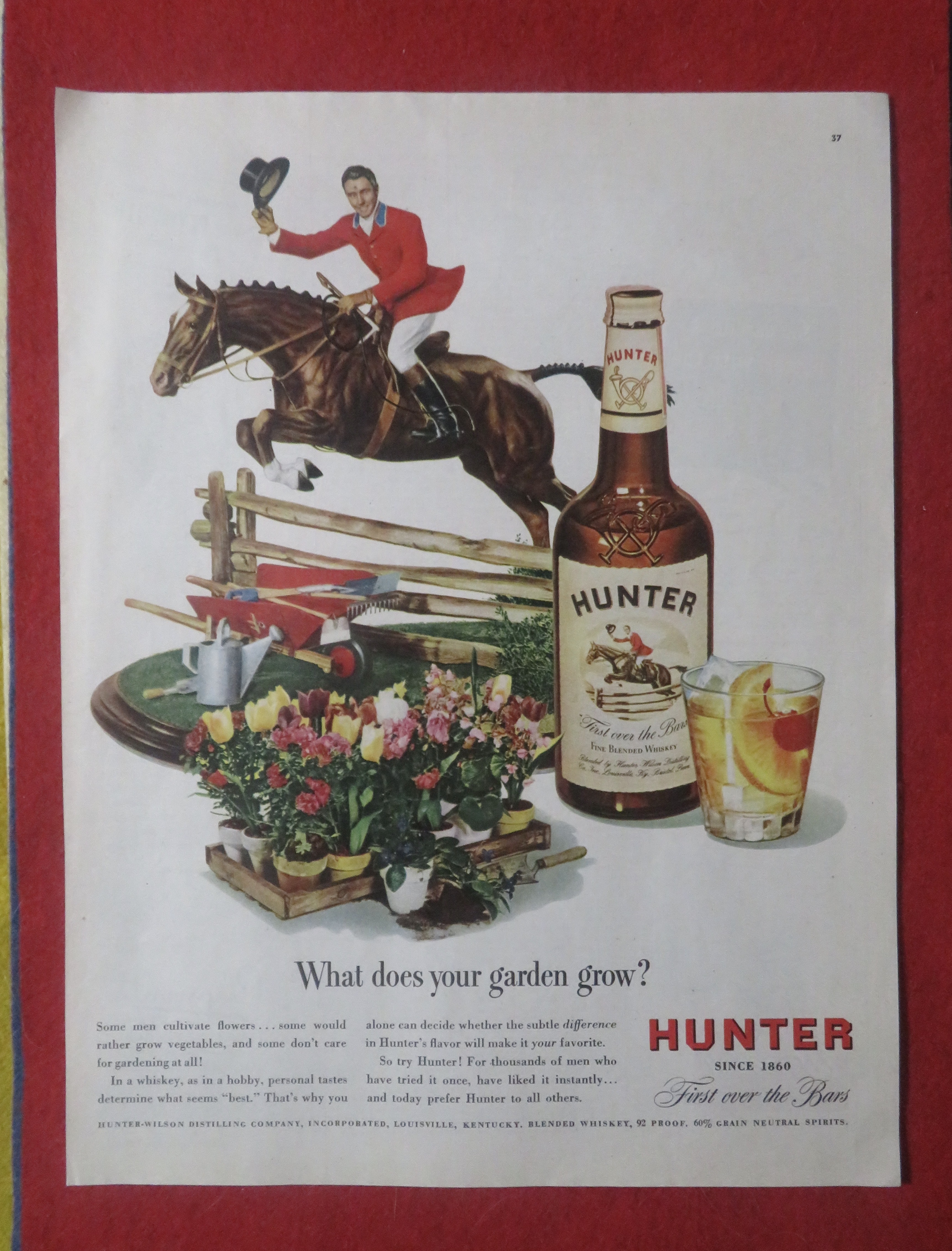 1948 Hunter Whiskey with Man on Horse Jumping Fence