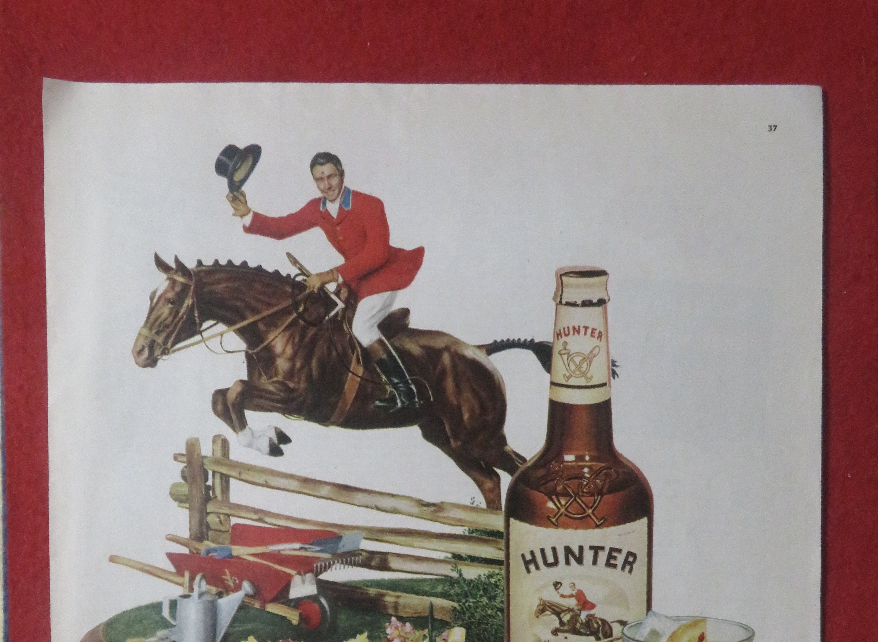 1948 Hunter Whiskey with Man on Horse Jumping Fence