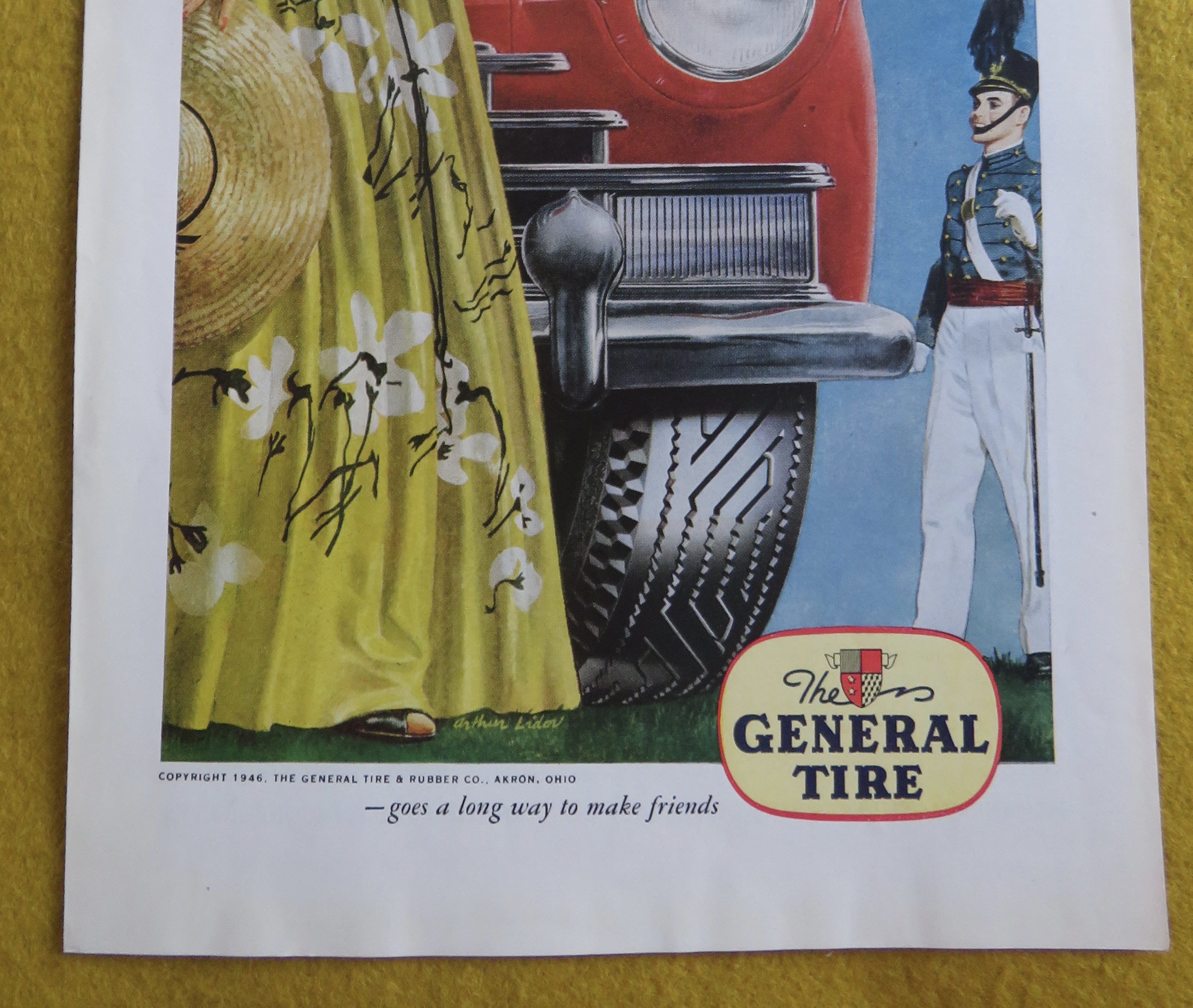 1946 General Tires with Soldier Standing By Car