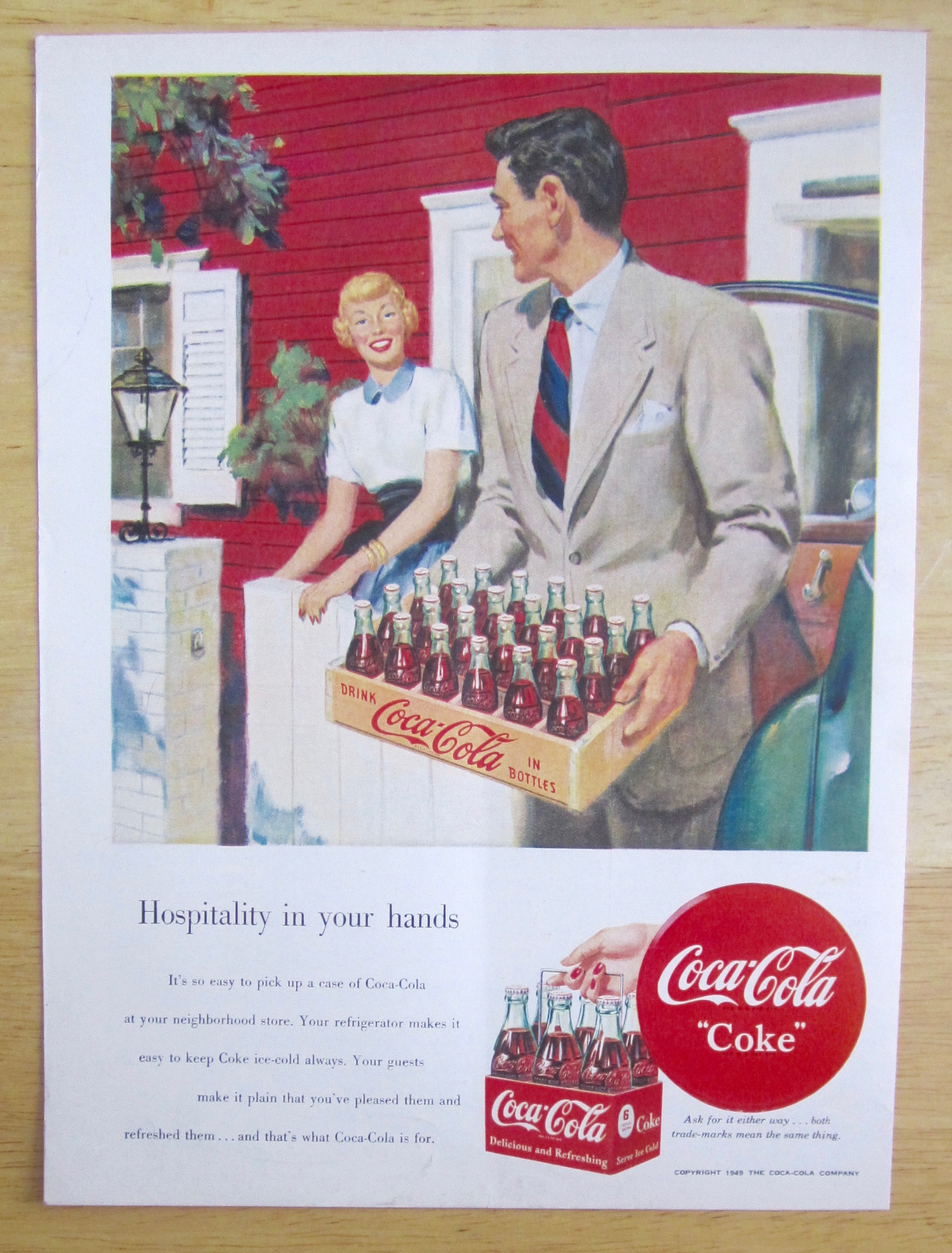1950 Coca Cola (Coke) with Man Carrying a Case of Coke