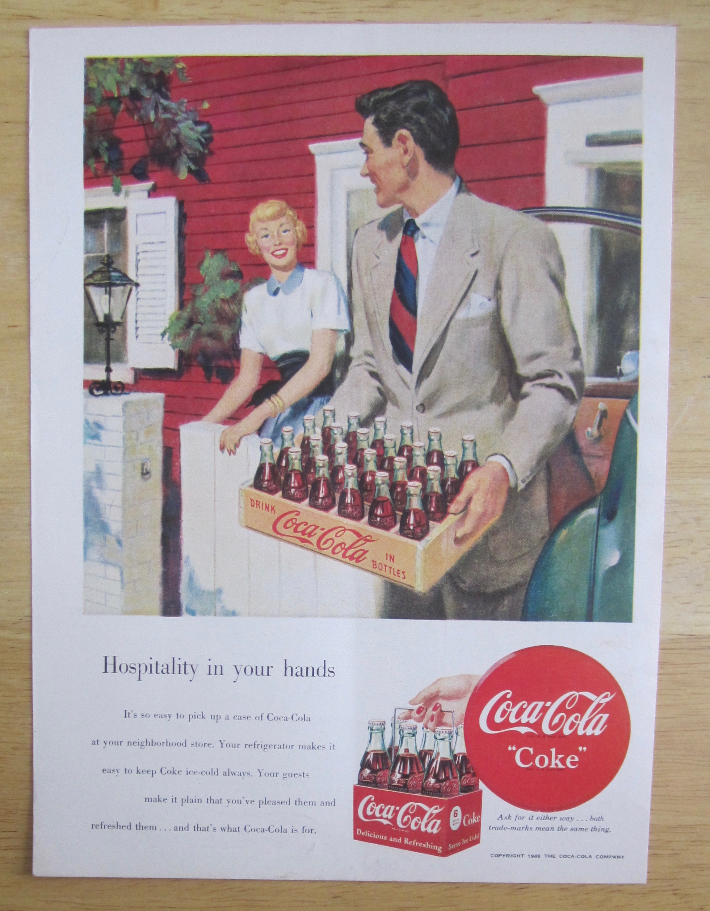 1950 Coca Cola (Coke) with Man Carrying a Case of Coke