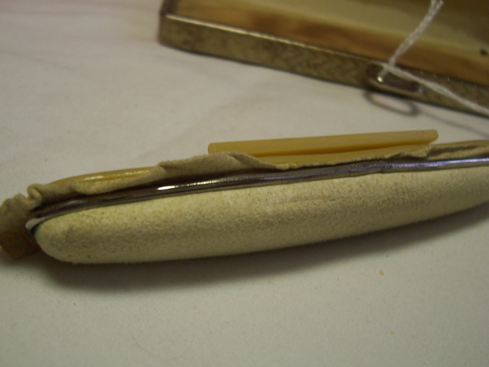 Bakelite Nail Buffer in case with sword