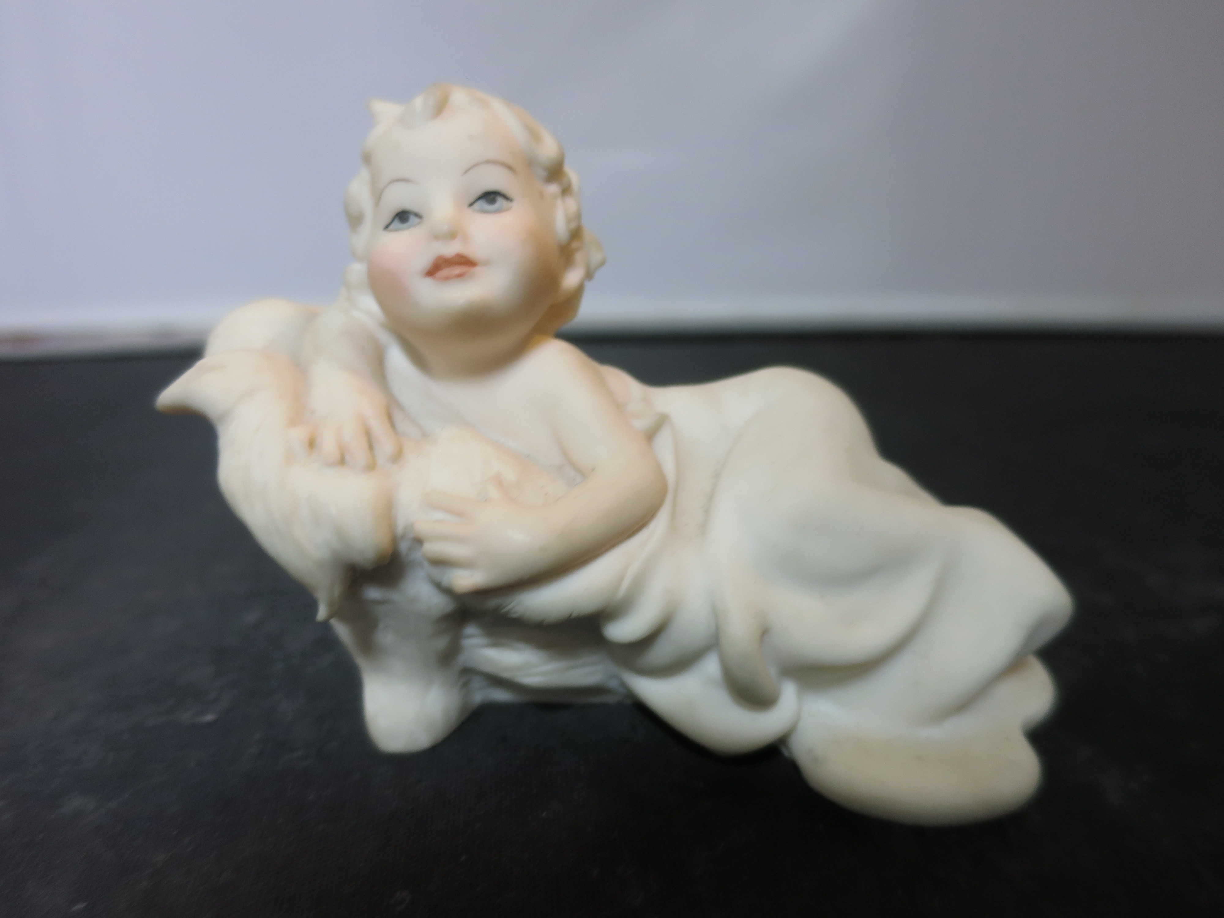 Florence Sculpture d'Arte child on fainting couch 1989 figurine