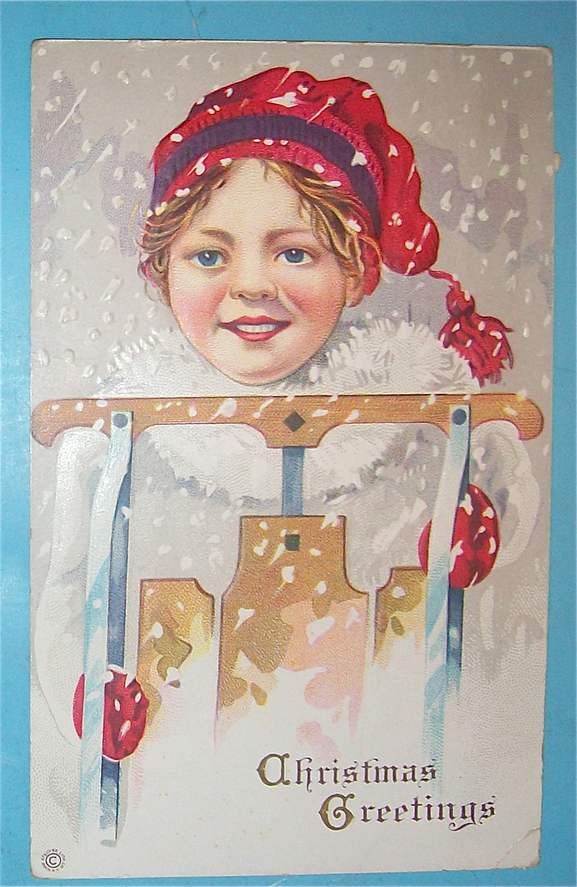 Christmas Greetings Postcard w/Girl Holding a Sled