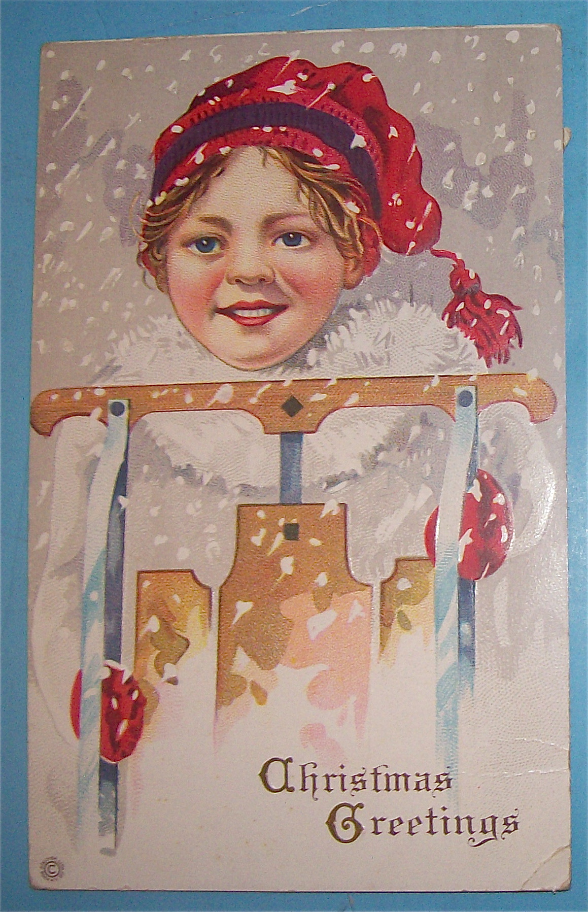 Christmas Greetings Postcard w/Girl Holding a Sled