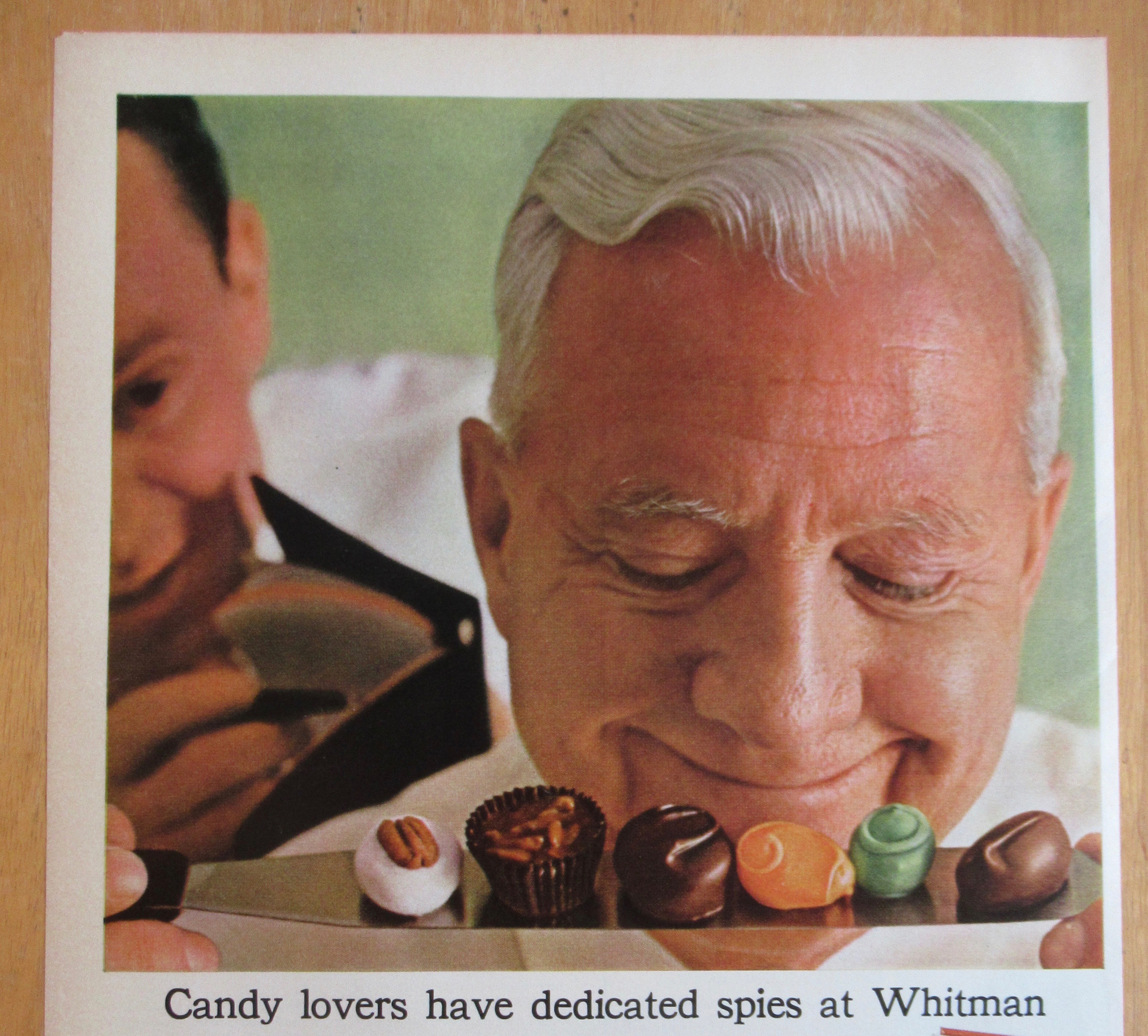 1964 Whitman's Candies with Man Smiling At Candy Pieces