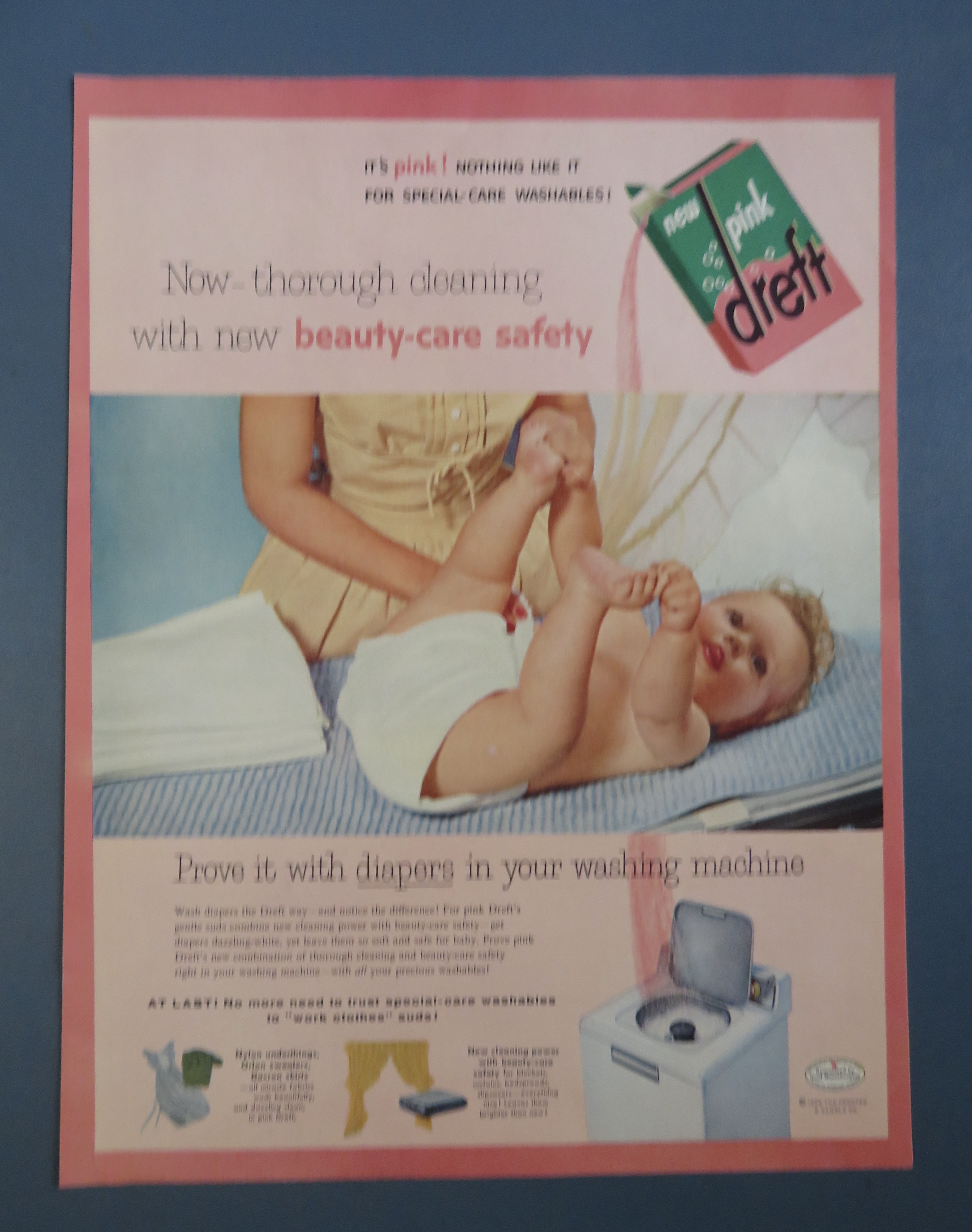 1956 Pink Dreft with Baby Laying On Table