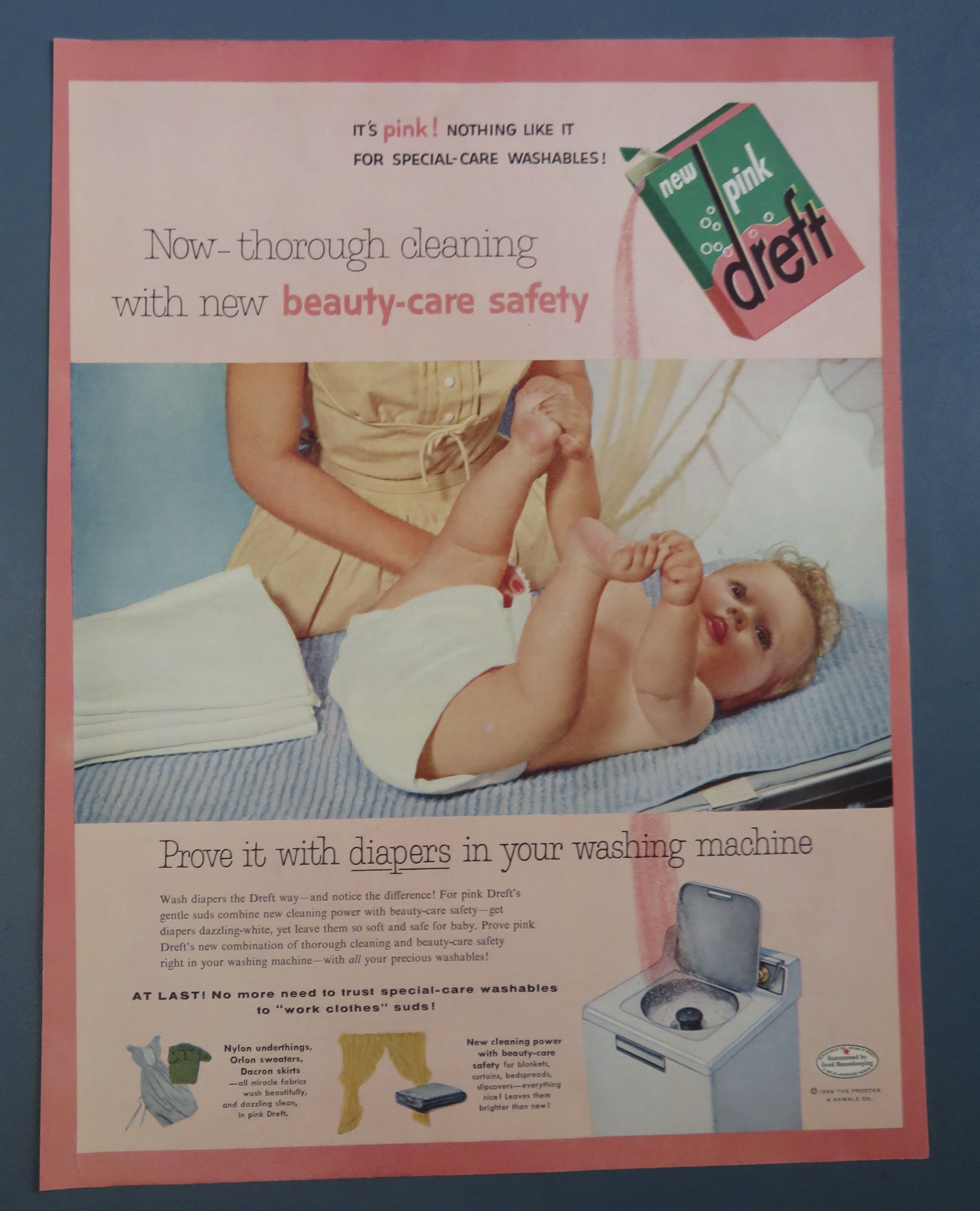 1956 Pink Dreft with Baby Laying On Table