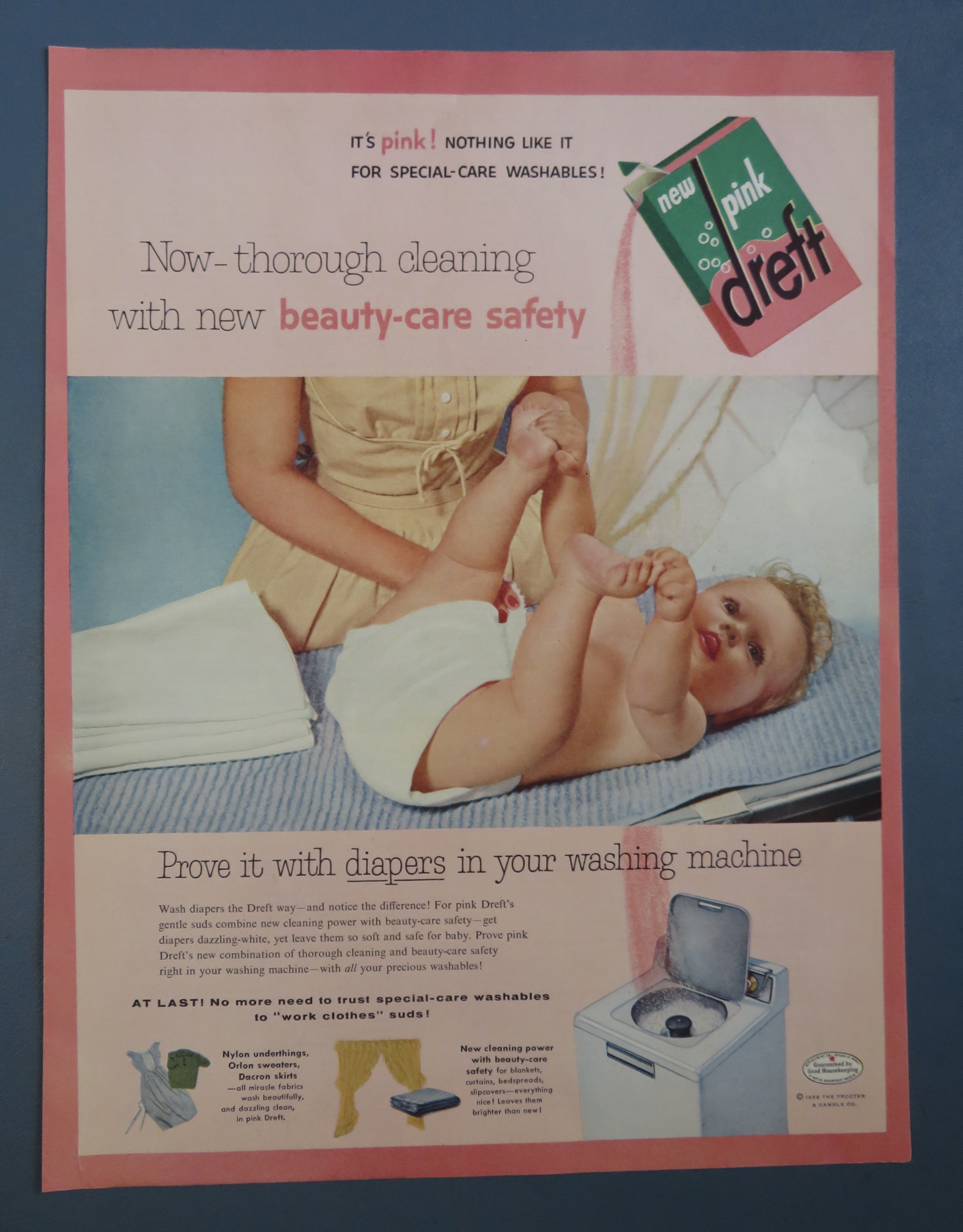 1956 Pink Dreft with Baby Laying On Table
