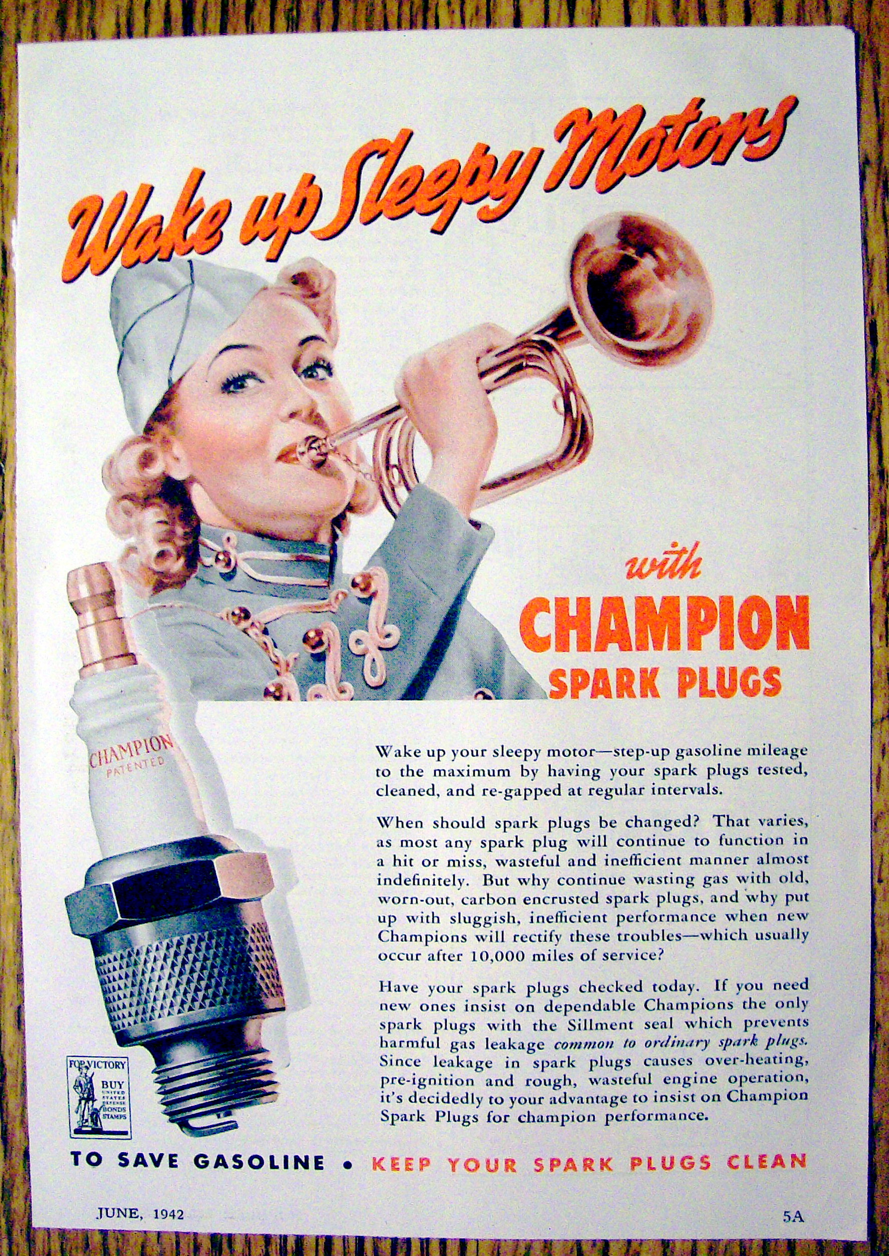 1942 Champion Spark Plugs with Woman Blowing Horn