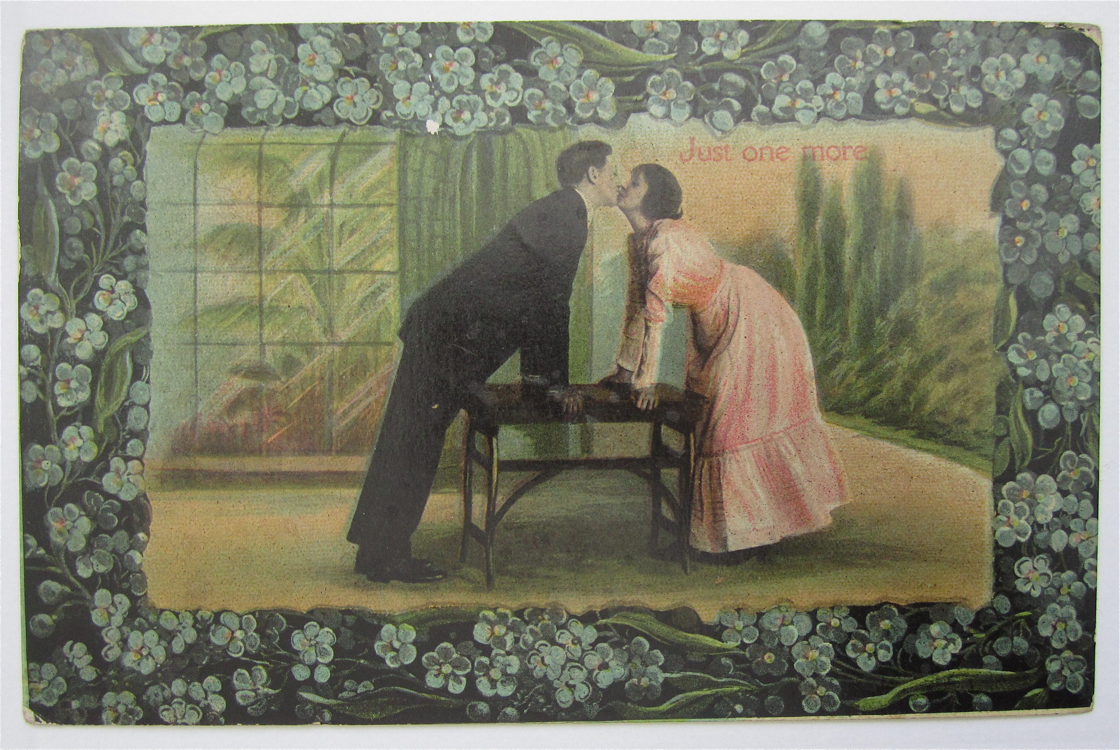 Man And Woman Kissing Over Table postcard