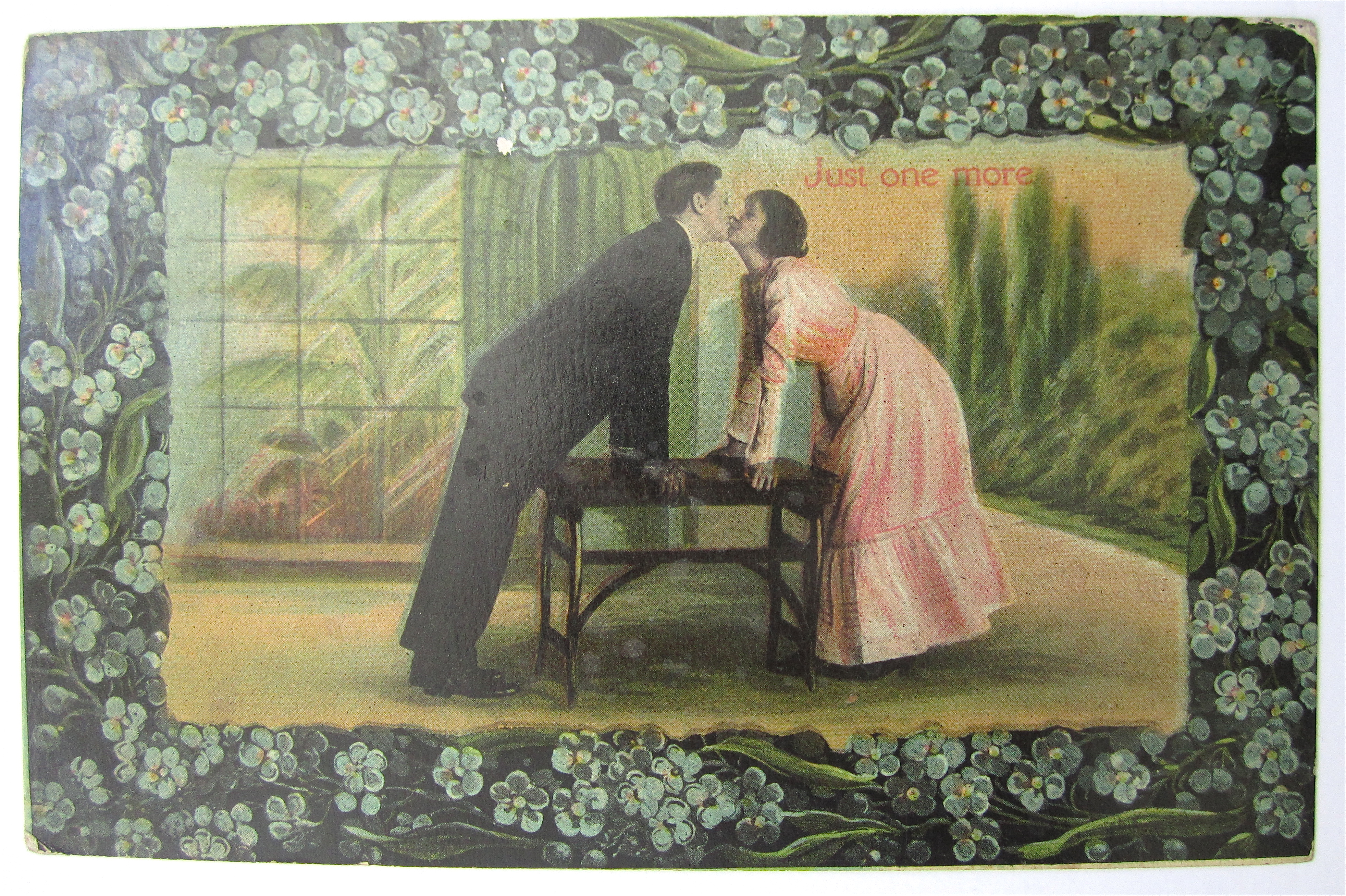 Man And Woman Kissing Over Table postcard
