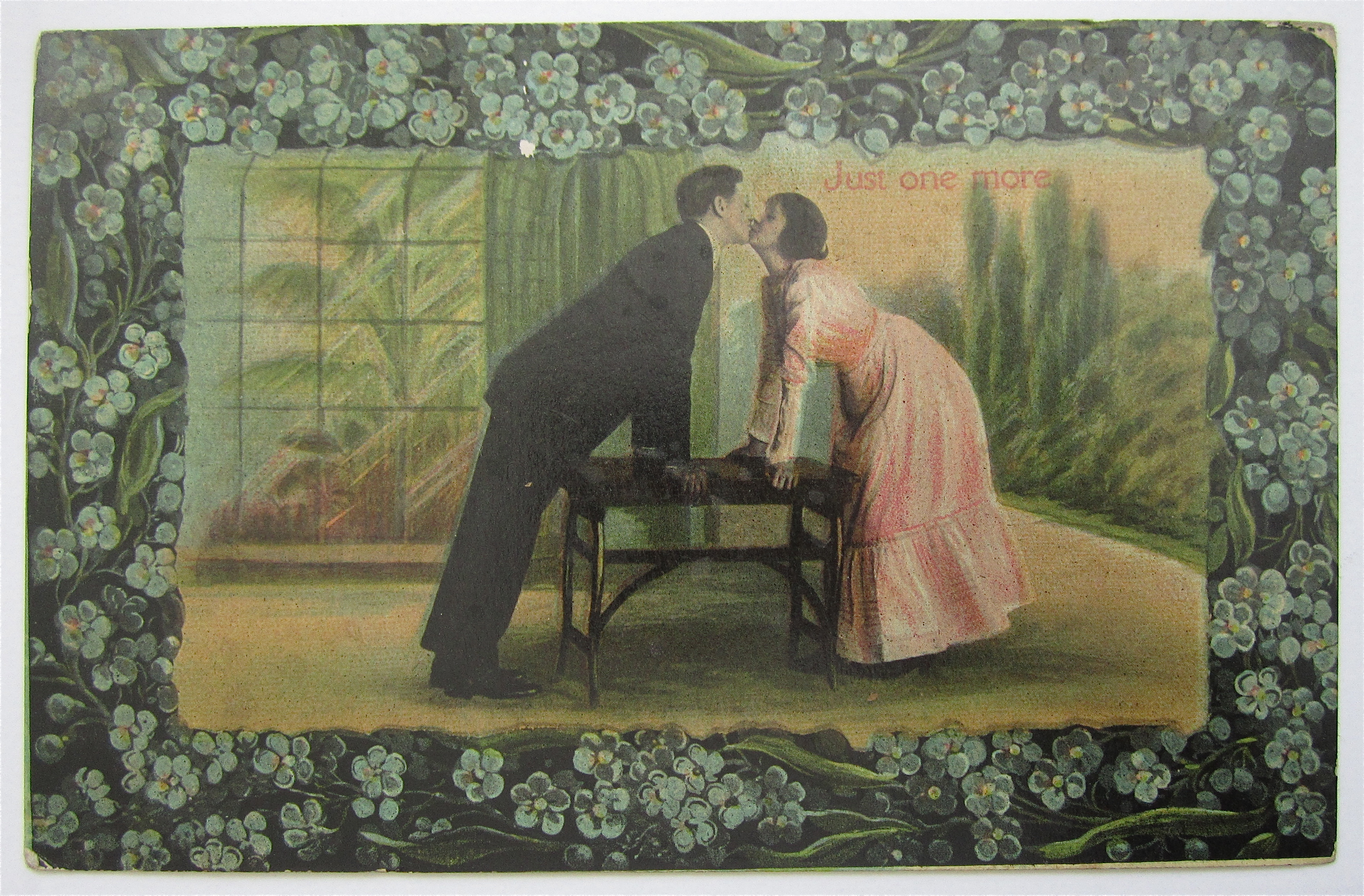 Man And Woman Kissing Over Table postcard