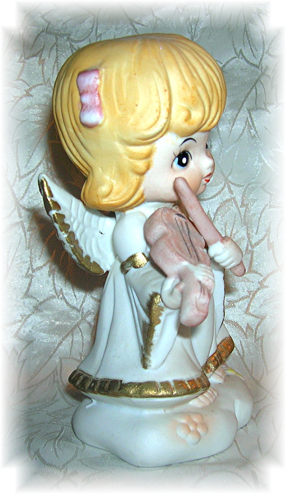 Porcelain Angel Figurine Playing A Violin....