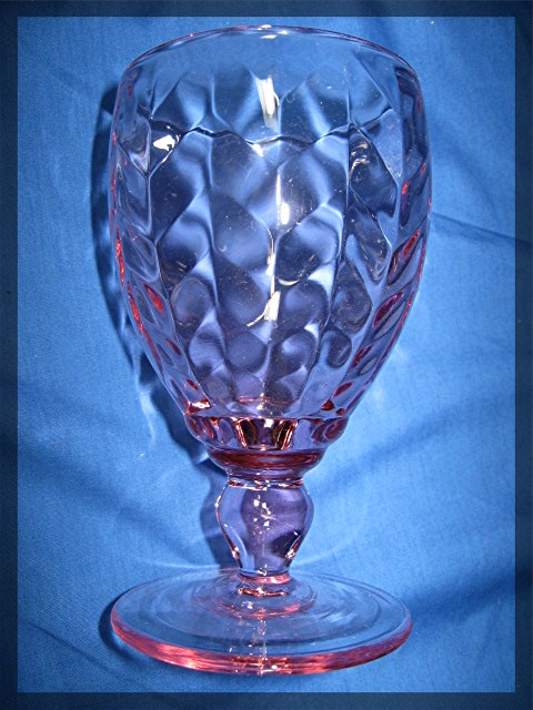 Pair of glass wine goblets in pink
