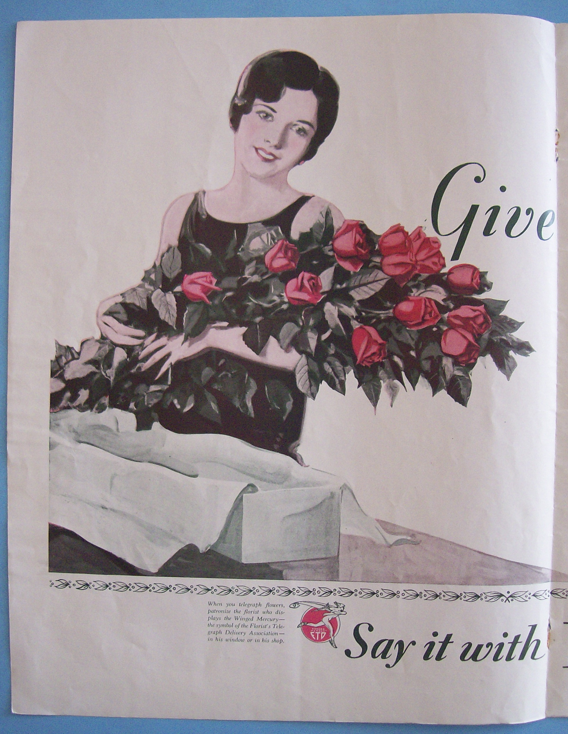 1929 Florists Telegraph Delivery (FTD) with Woman Holding a Bouquet of Flowers