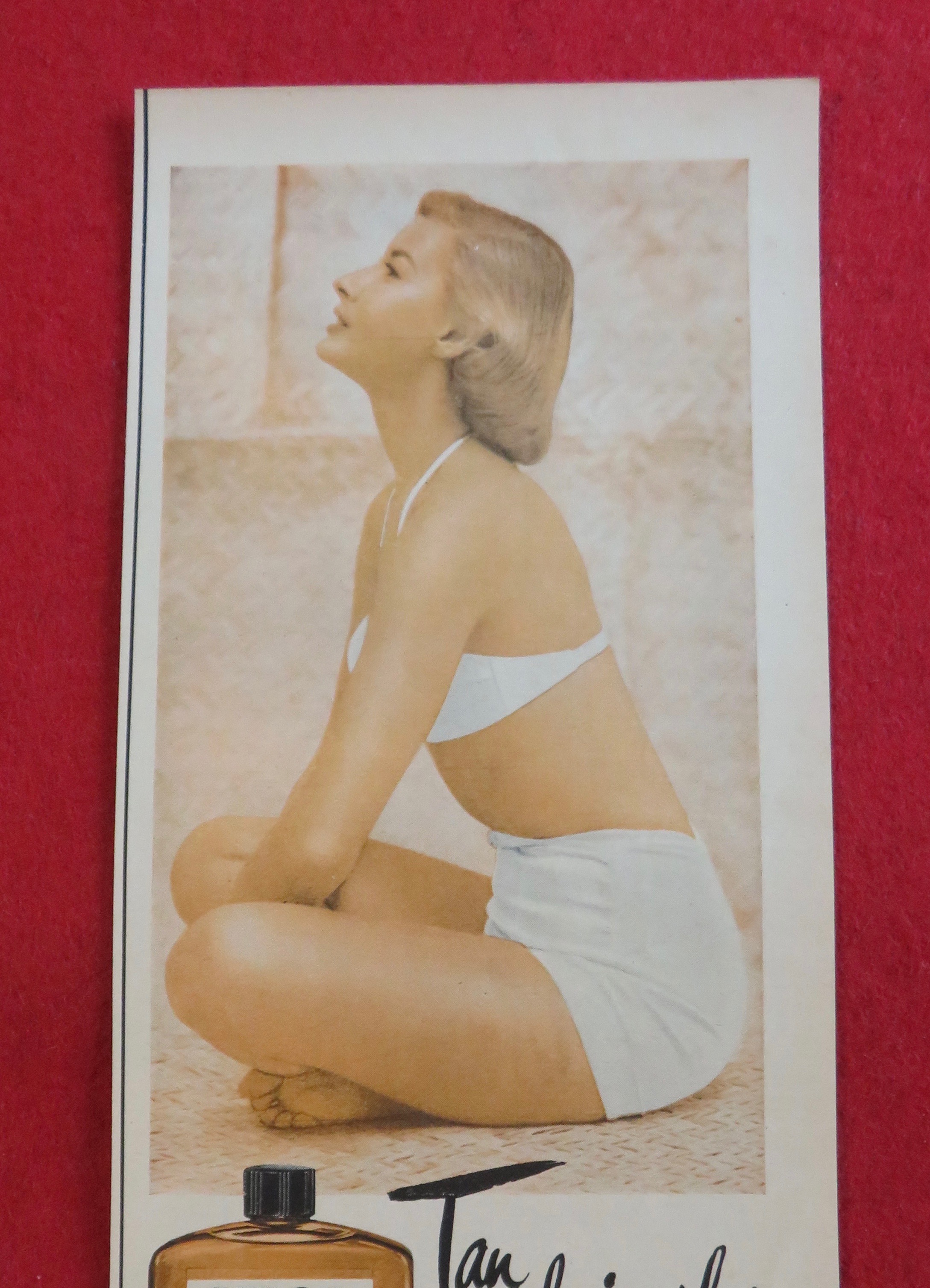 1951 Skol Tan Lotion with Woman Sitting In Swimsuit