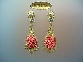 Celebrity clip earrings in gold tone and coral pink