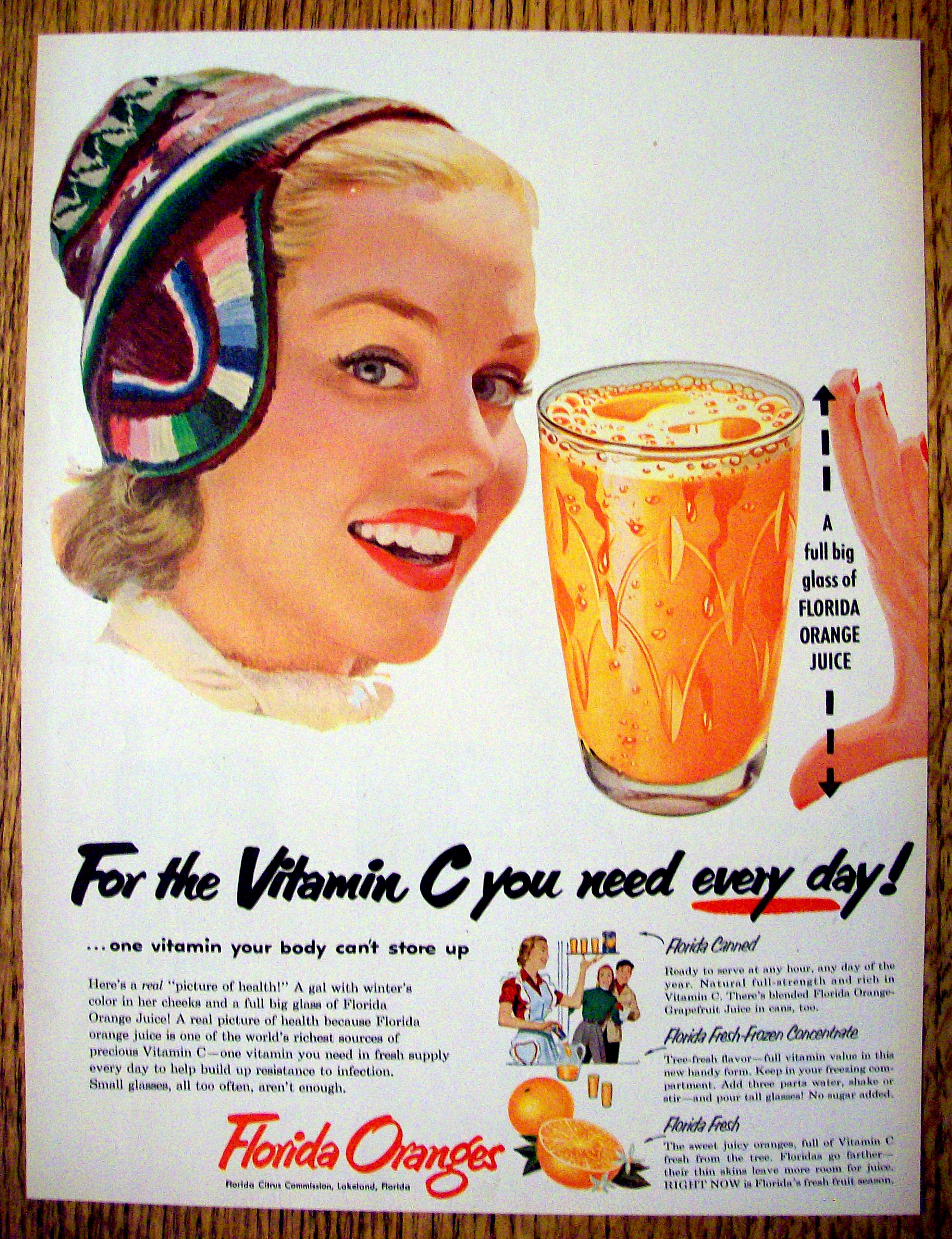 1953 Florida Oranges with Woman Holding Hands To Glass
