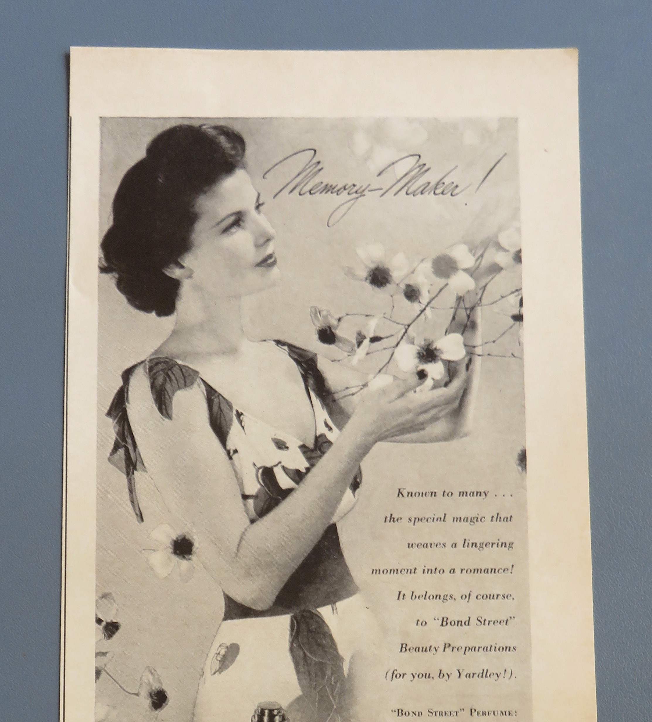 1943 Yardley with Lovely Woman Looking At Flowers